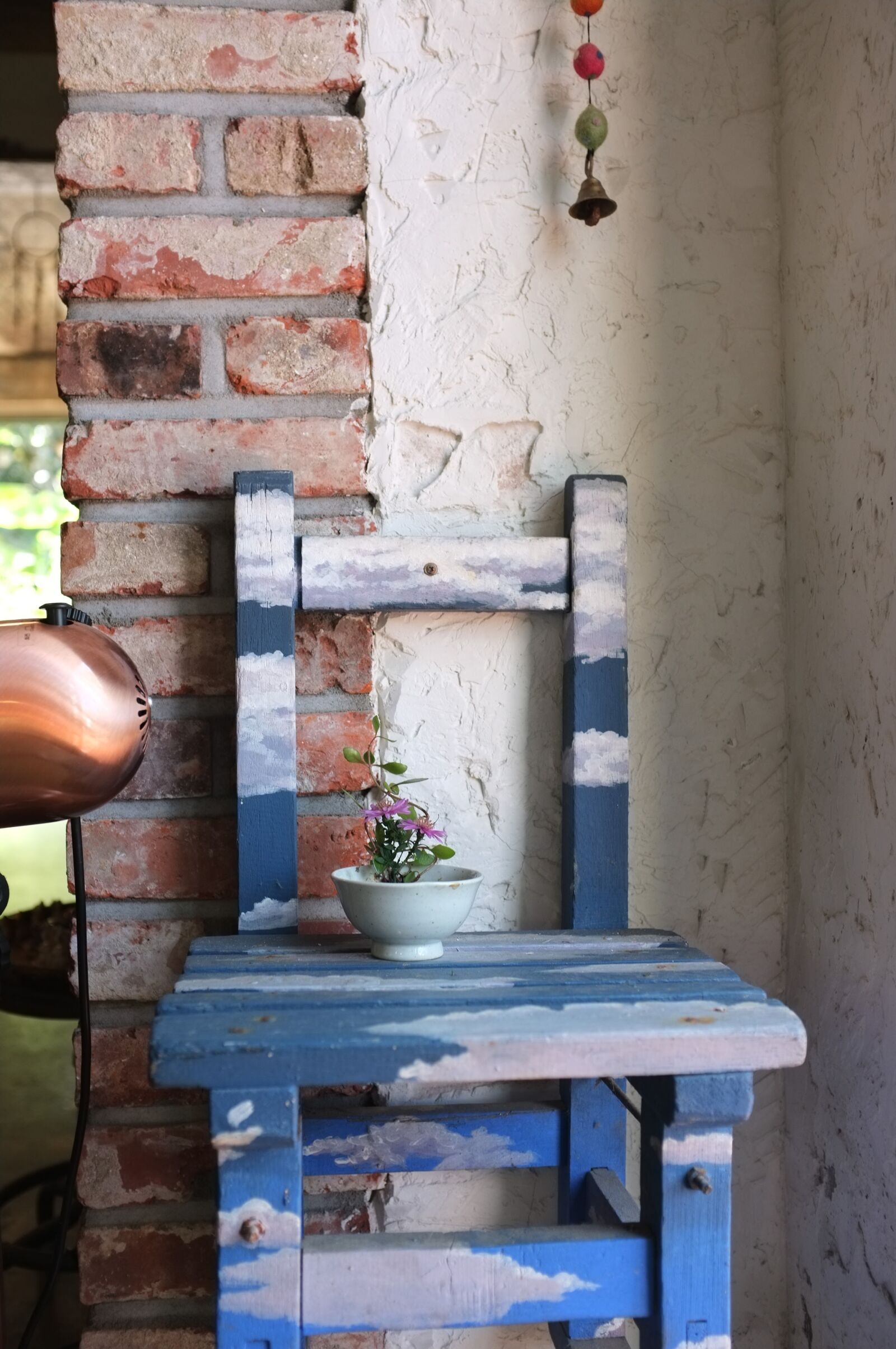 Fujifilm FinePix X100 sample photo. Chair, flowers, cafe photography