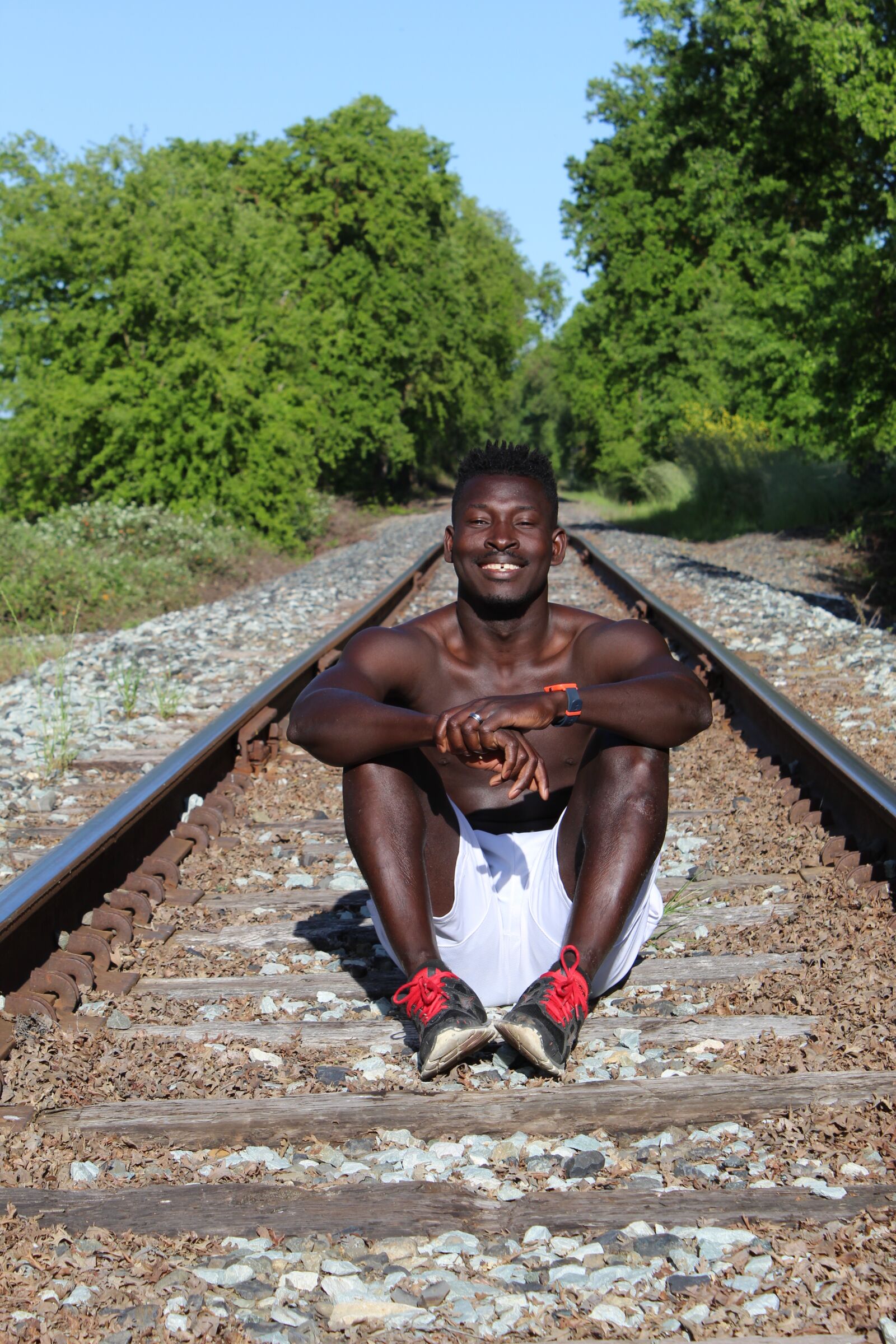Canon EOS 1300D (EOS Rebel T6 / EOS Kiss X80) sample photo. Train track, black man photography
