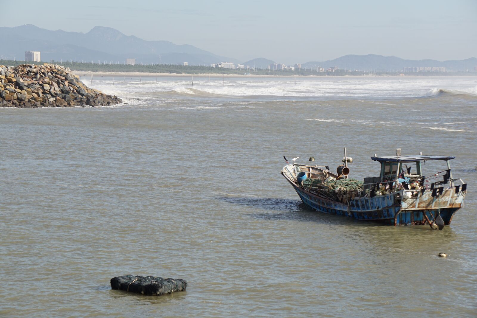 Sony E 55-210mm F4.5-6.3 OSS sample photo. Boat, ocean, sea photography