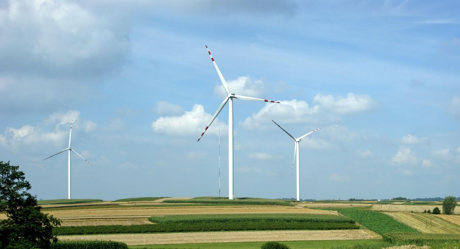 Sony Alpha DSLR-A290 sample photo. Blue sky, clouds, windmill photography