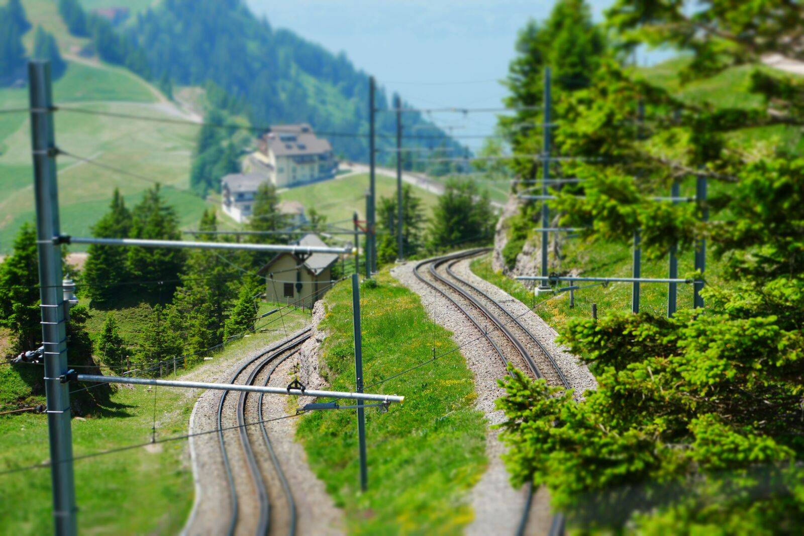 Panasonic DMC-G81 sample photo. Rails, mountains, miniature effect photography