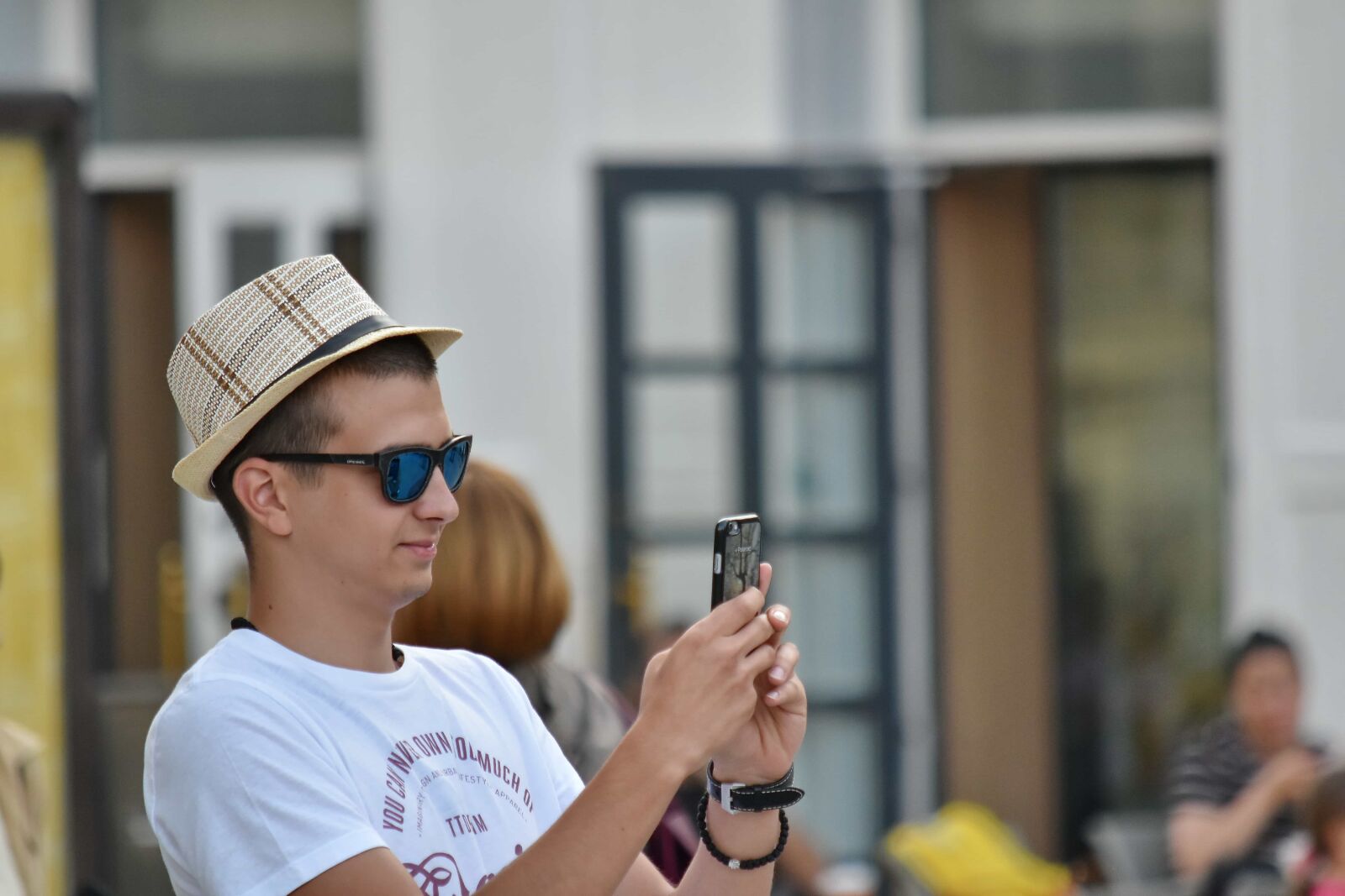 Nikon D5500 sample photo. Cellphone, handsome, hat, man photography