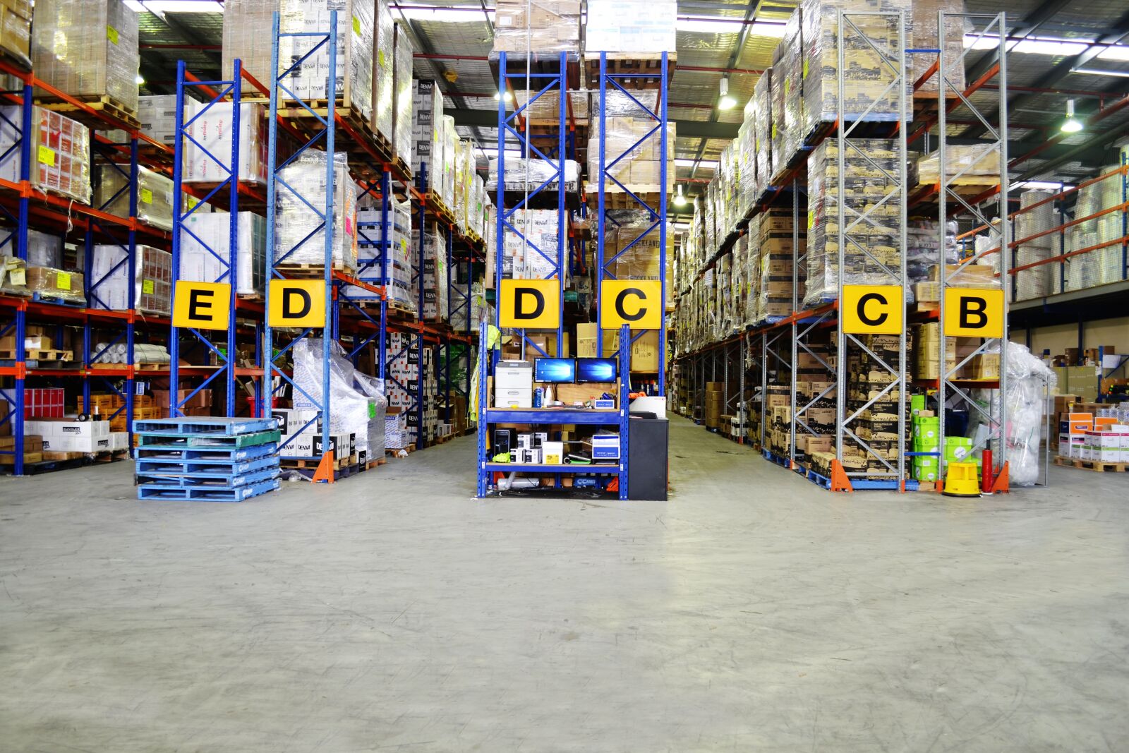 Nikon D3100 sample photo. Warehouse, shelves, building photography