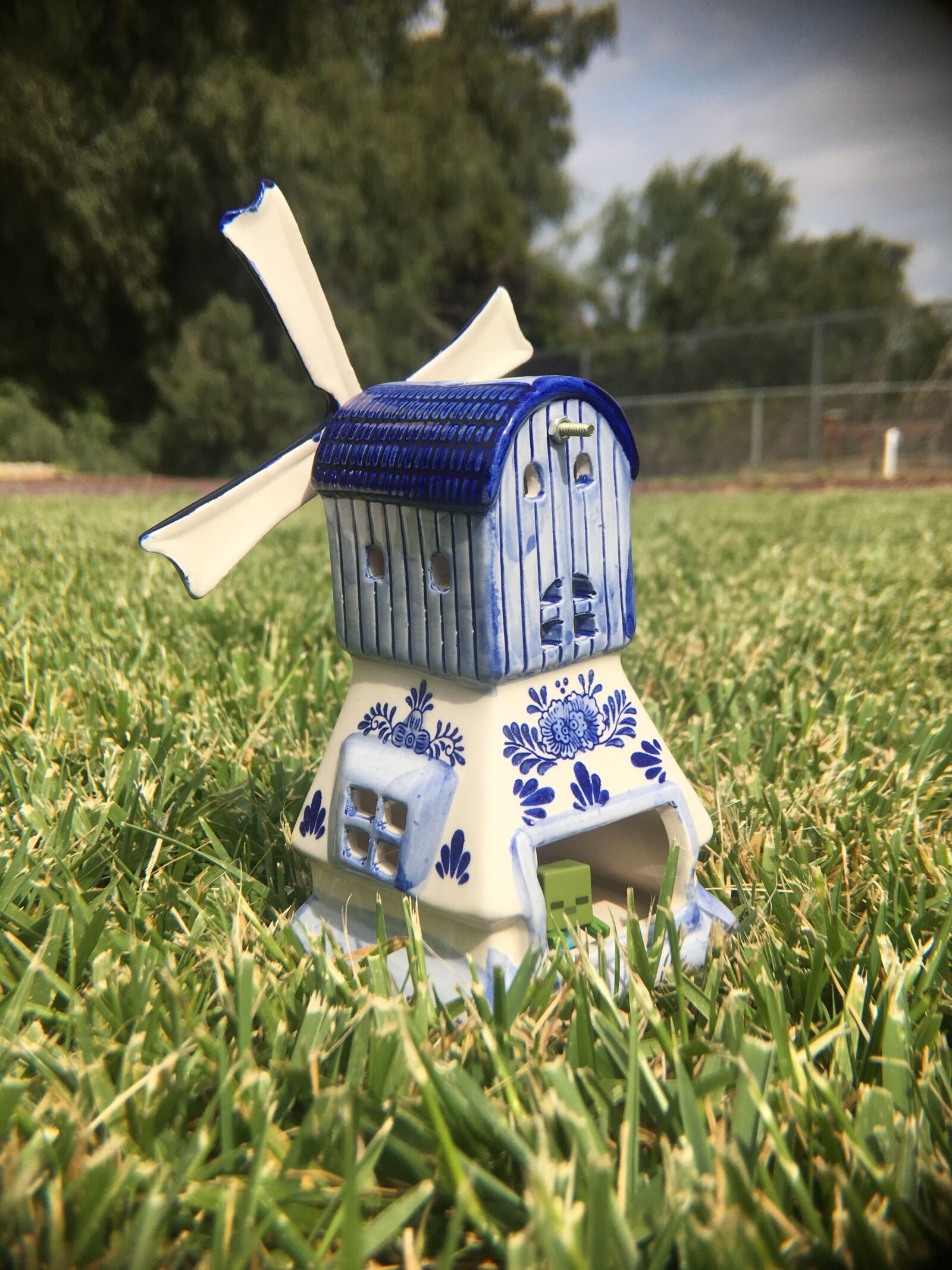 Apple iPhone 6s sample photo. Zombie, windmill, blue photography