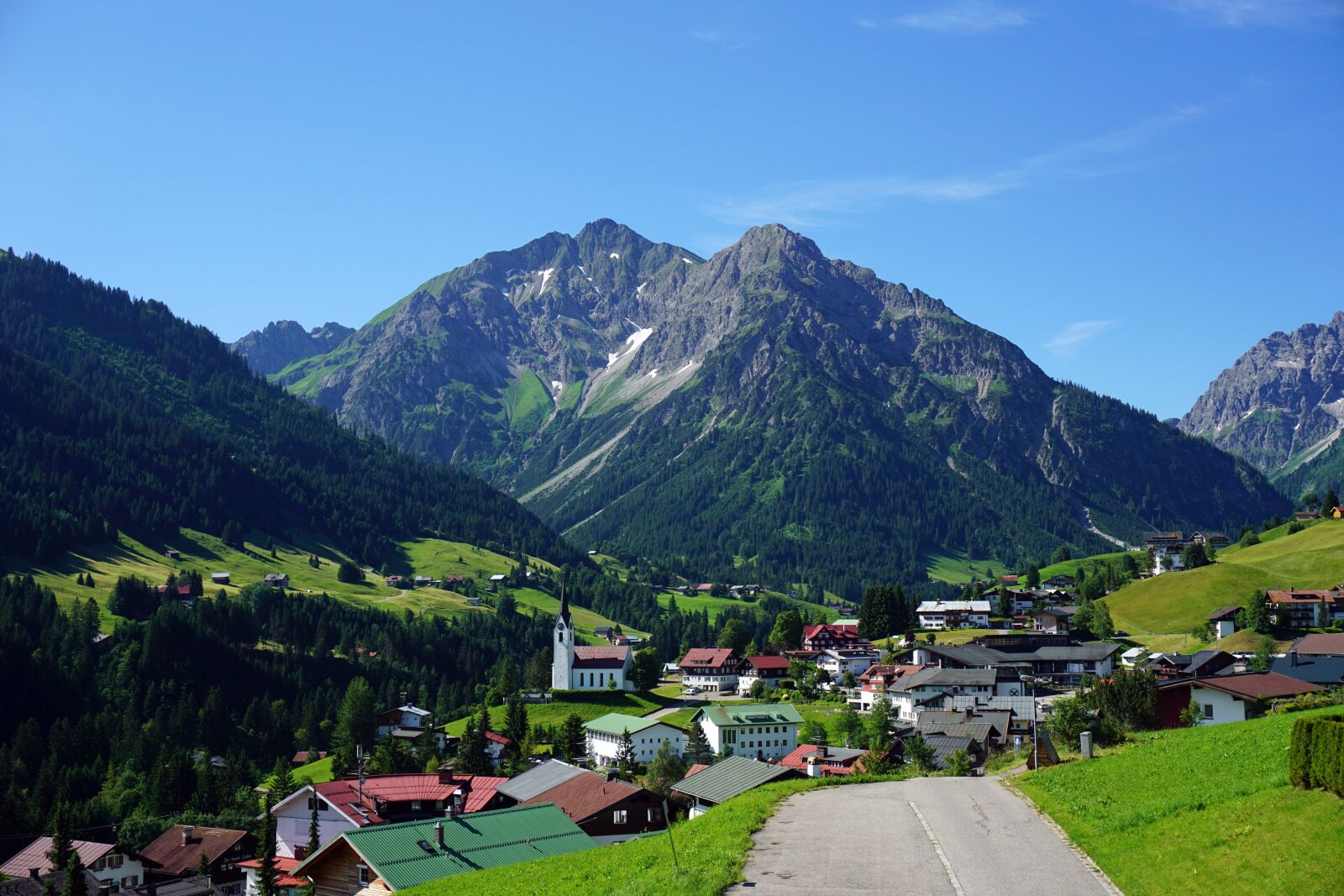 Sony a6000 sample photo. Mountain, village, church photography