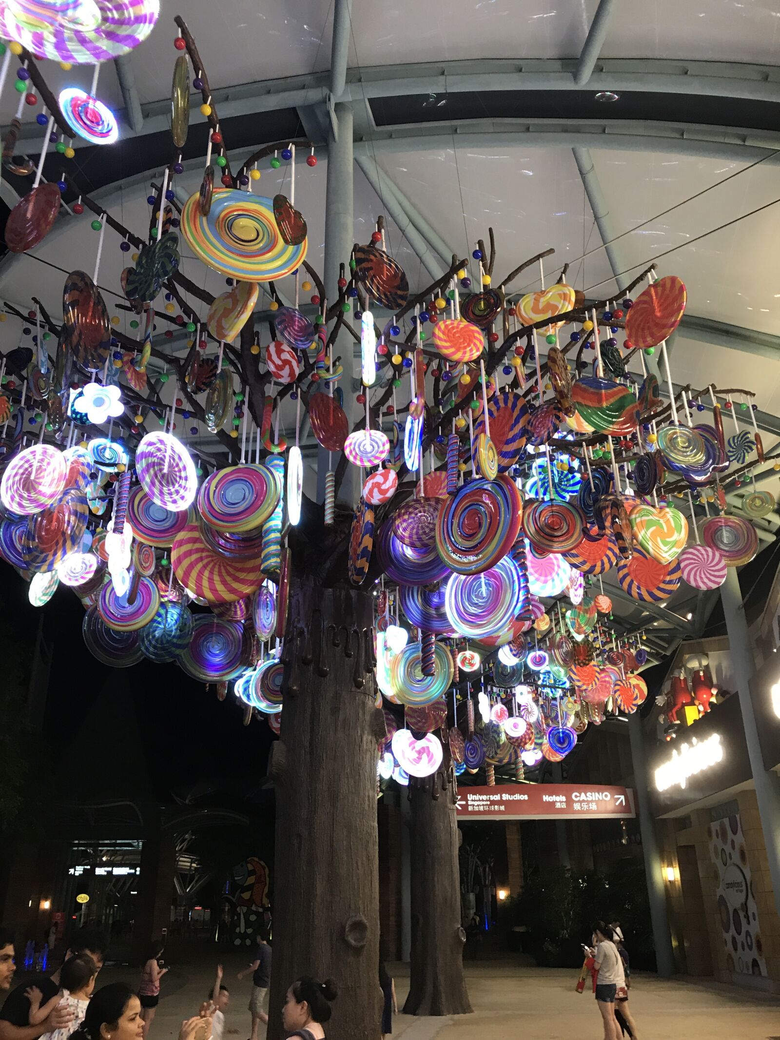 iPhone 7 back camera 3.99mm f/1.8 sample photo. Candy, night, shop, singapore photography