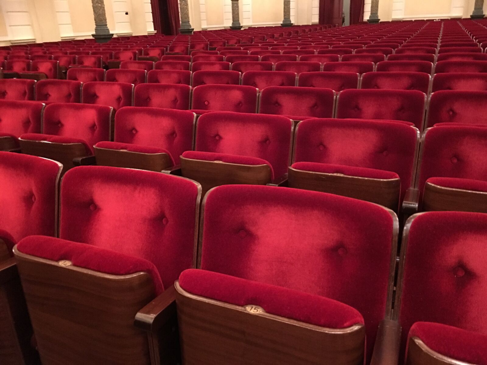 Apple iPhone 6s Plus sample photo. Red, chair, concert hall photography
