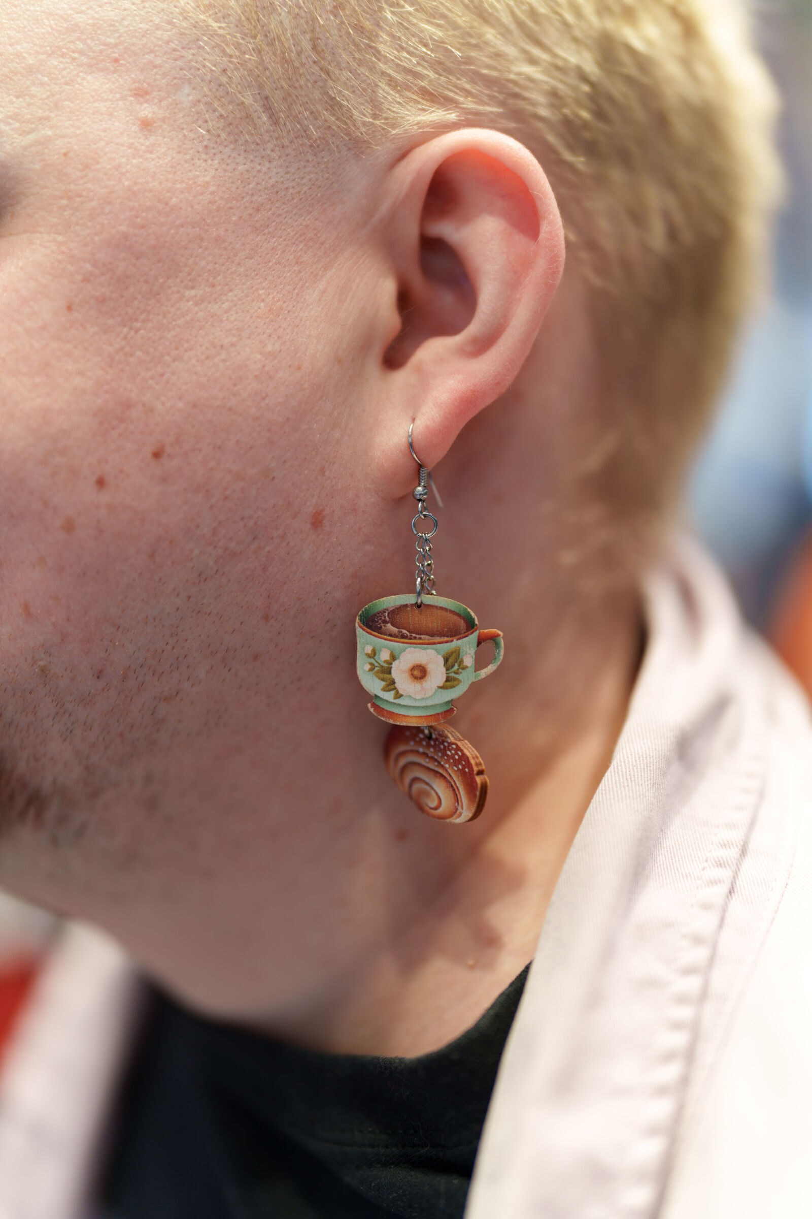 Sony a7R V sample photo. Coffee and bun earrings photography