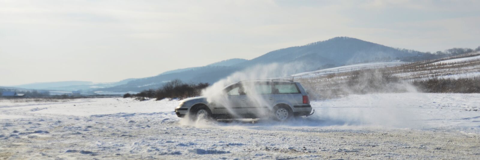 Nikon D5100 sample photo. Snowy landscape, car, speed photography