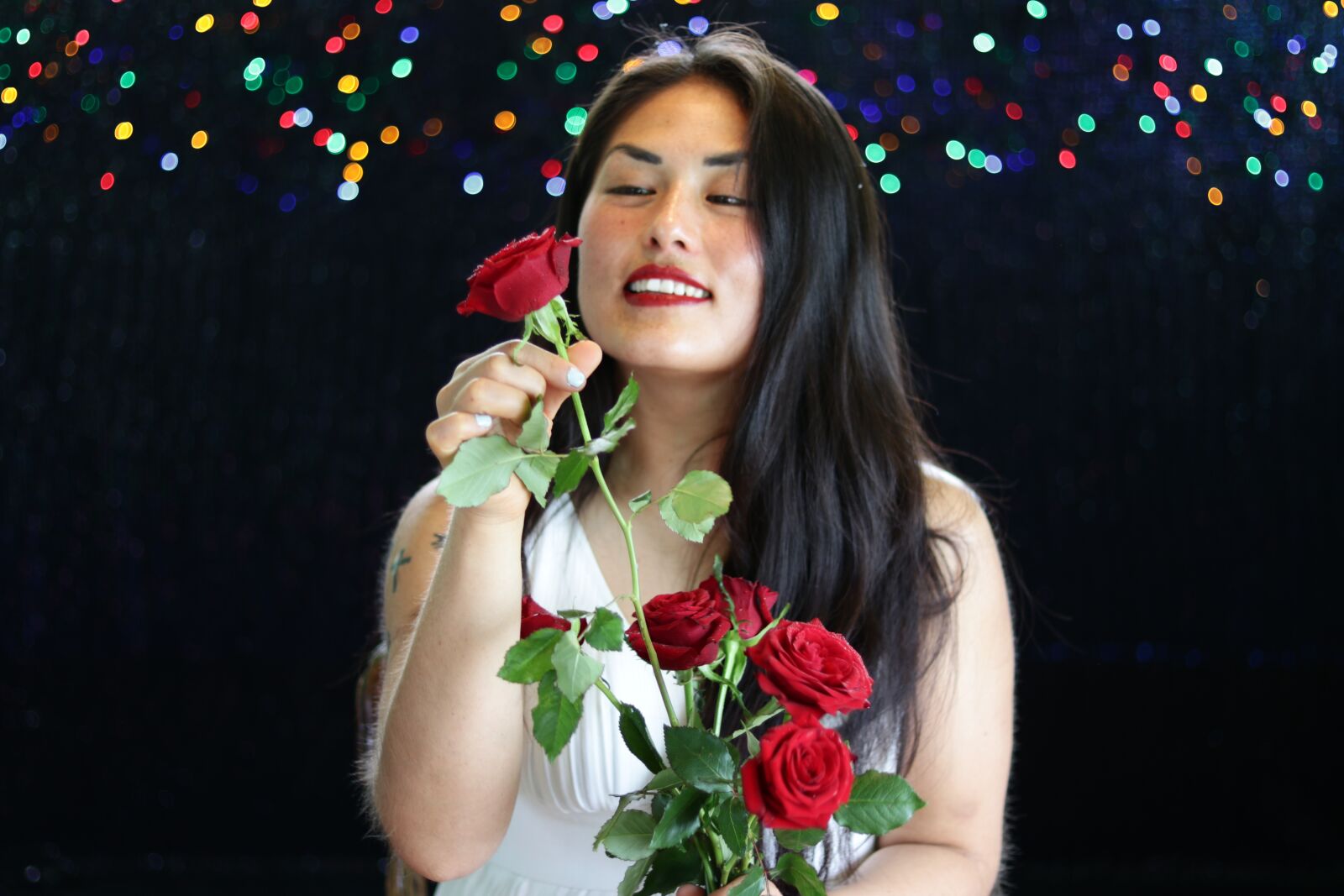 Canon EOS 80D + Canon EF 50mm F1.8 STM sample photo. Bokeh lights, red roses photography