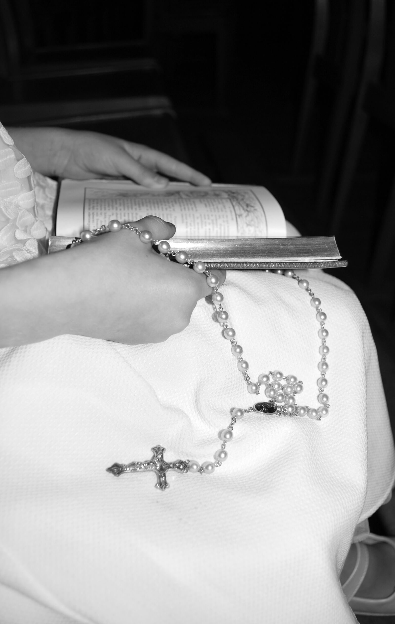 Nikon D60 sample photo. Catholic cross, white dress photography