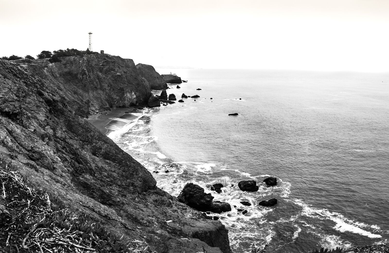 E 21mm F2.8 sample photo. Coast, black, white photography