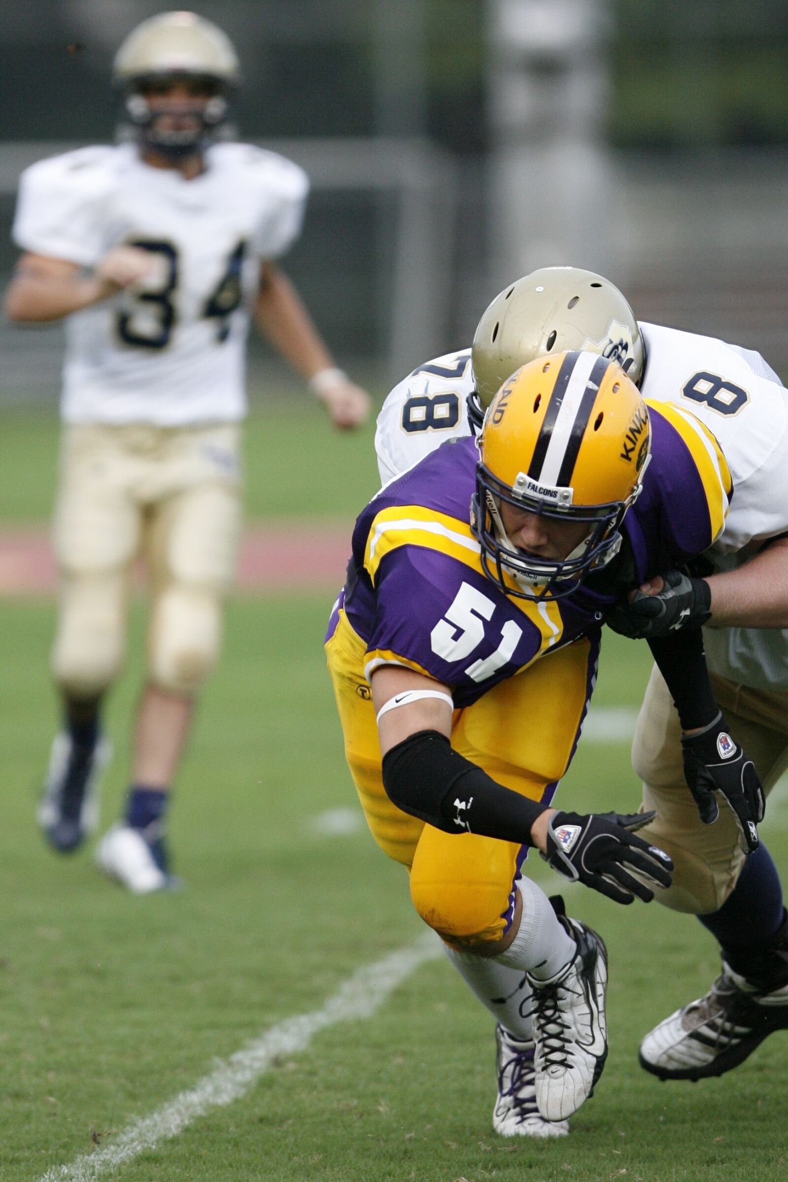 Canon EOS-1D Mark II N sample photo. Football, defense, football player photography