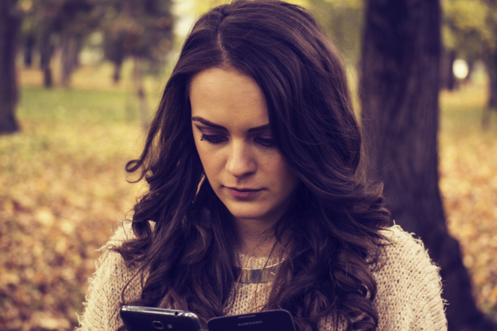 Nikon D3100 sample photo. Girl looking at phone photography