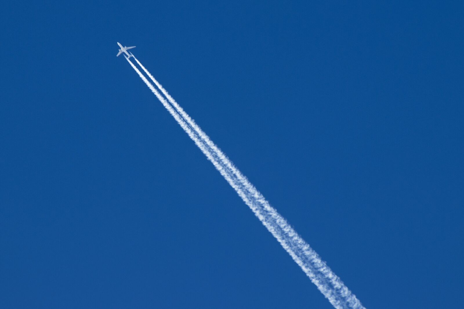 Canon EF75-300mm f/4-5.6 sample photo. Plane, blue sky, blue photography