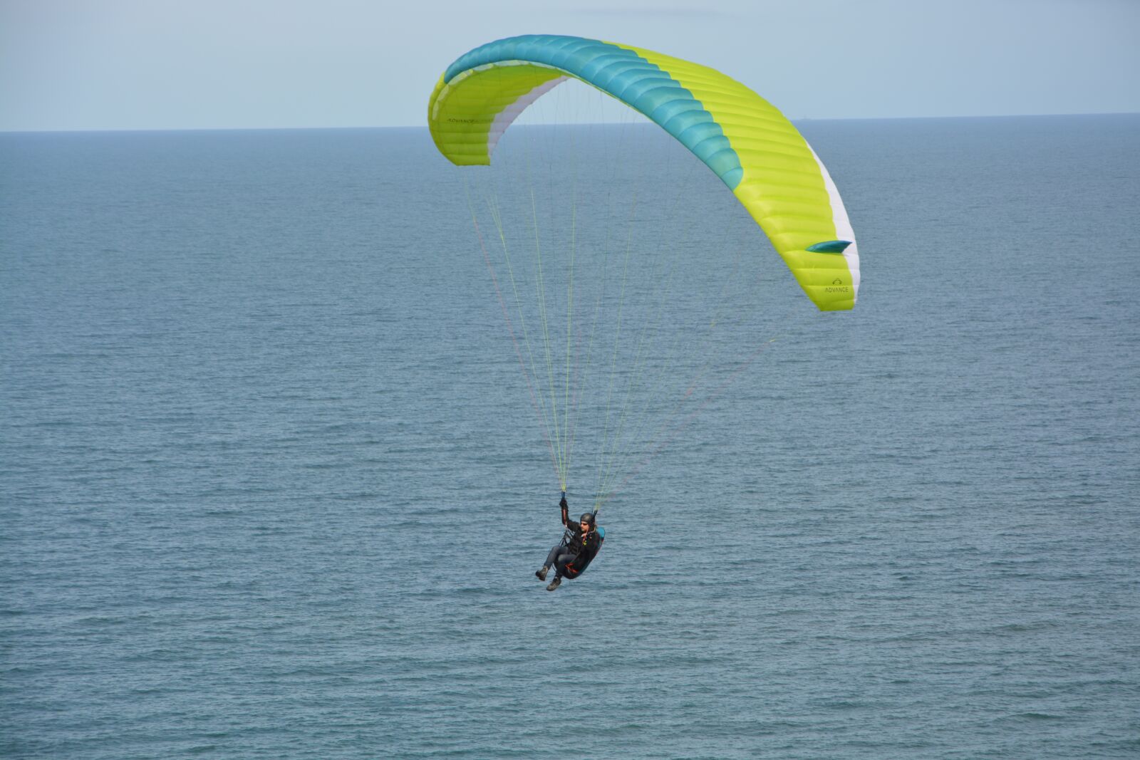Nikon D5200 sample photo. Paragliding flight over sea photography