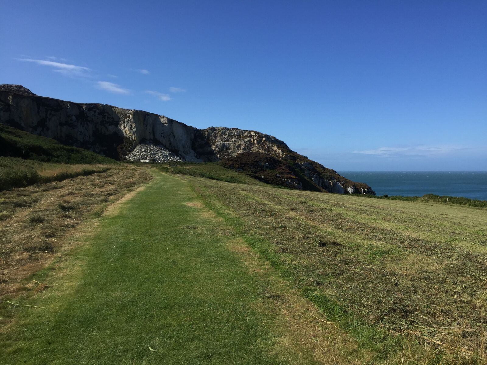 Apple iPhone 6 sample photo. Cliffs, blue sky, grass photography