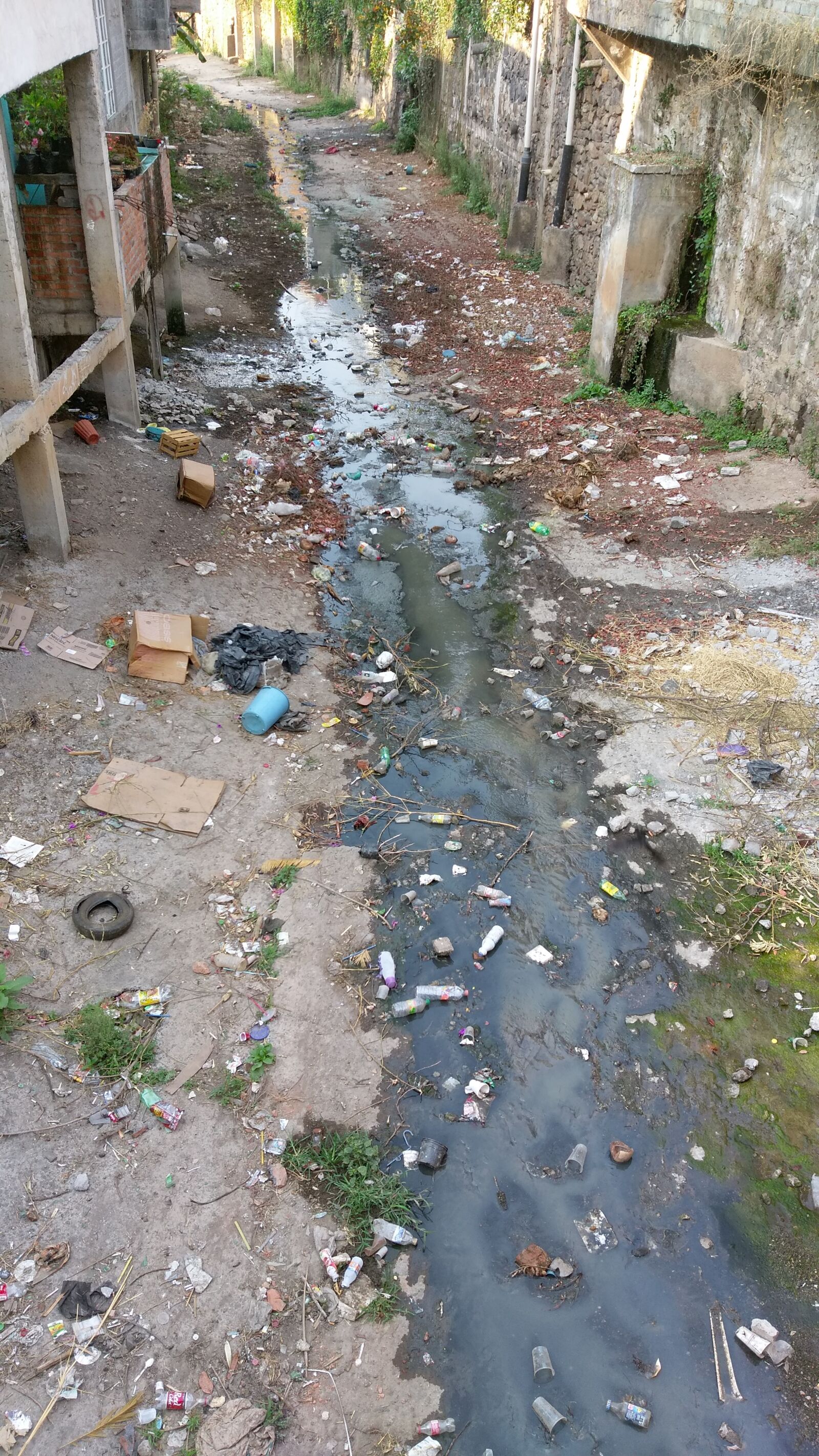 HTC ONE A9 sample photo. Gutter, litter, poverty, sewer photography