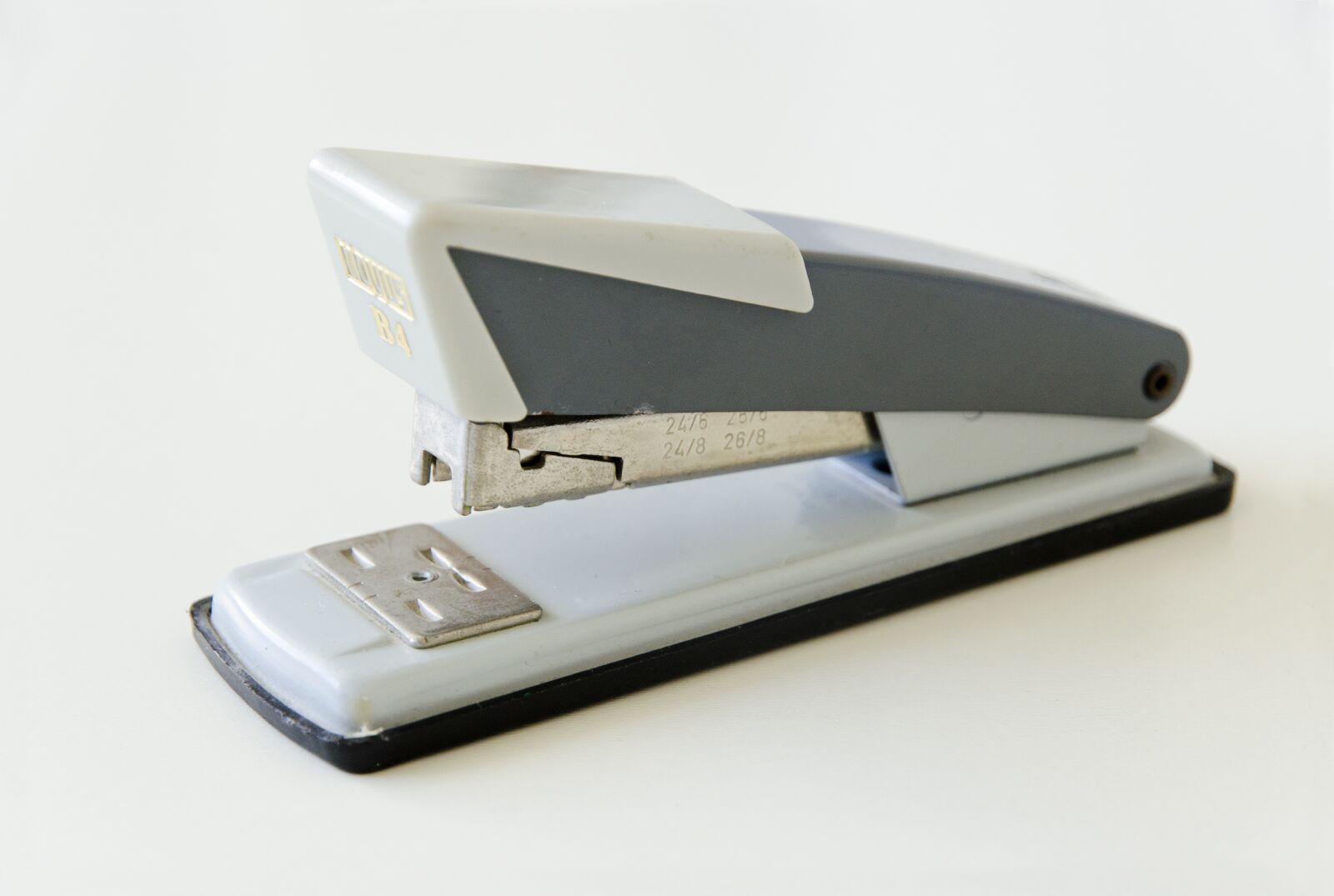 Nikon D5100 sample photo. Vintage stapler, staple machine photography