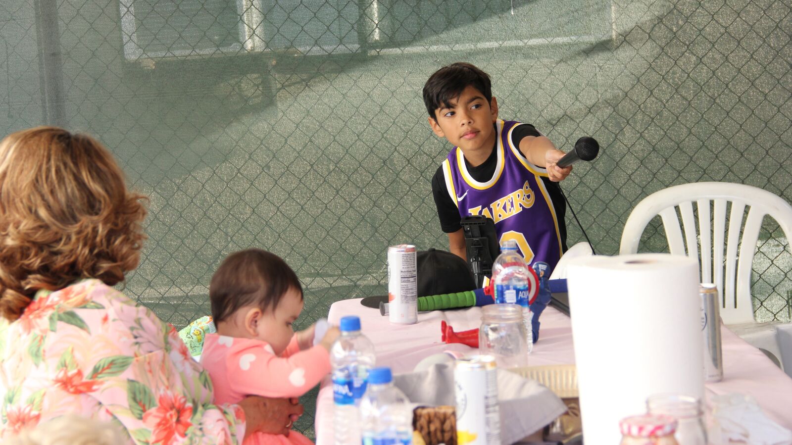 Canon EF-S 18-135mm F3.5-5.6 IS sample photo. Kid, singing, karaoke photography