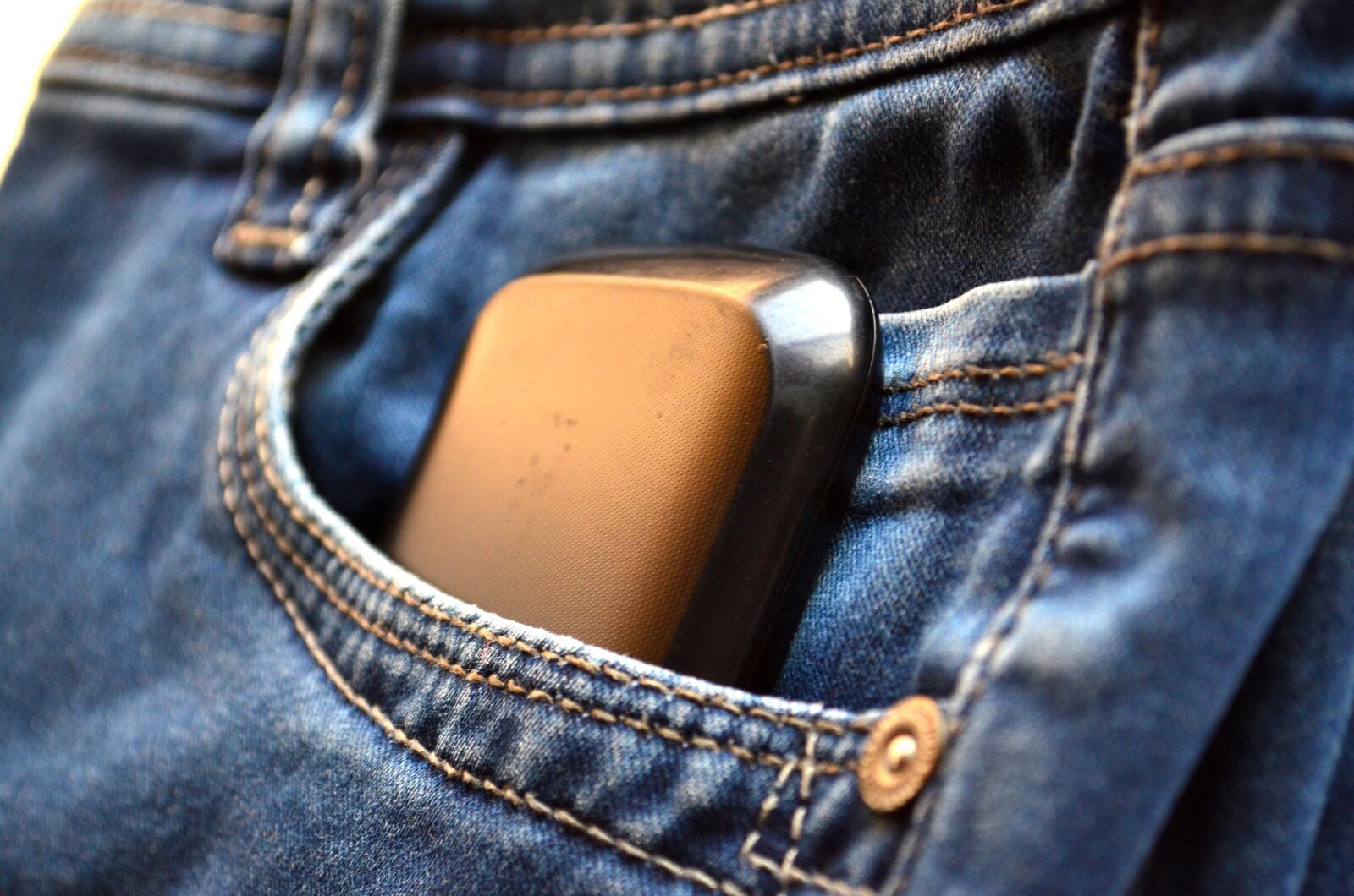 Nikon D5100 sample photo. Jeans, pocket, mobile phone photography