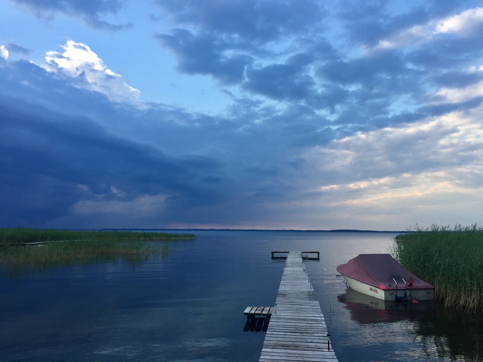 iPhone 6 back camera 4.15mm f/2.2 sample photo. Beach, boat, calm, waters photography