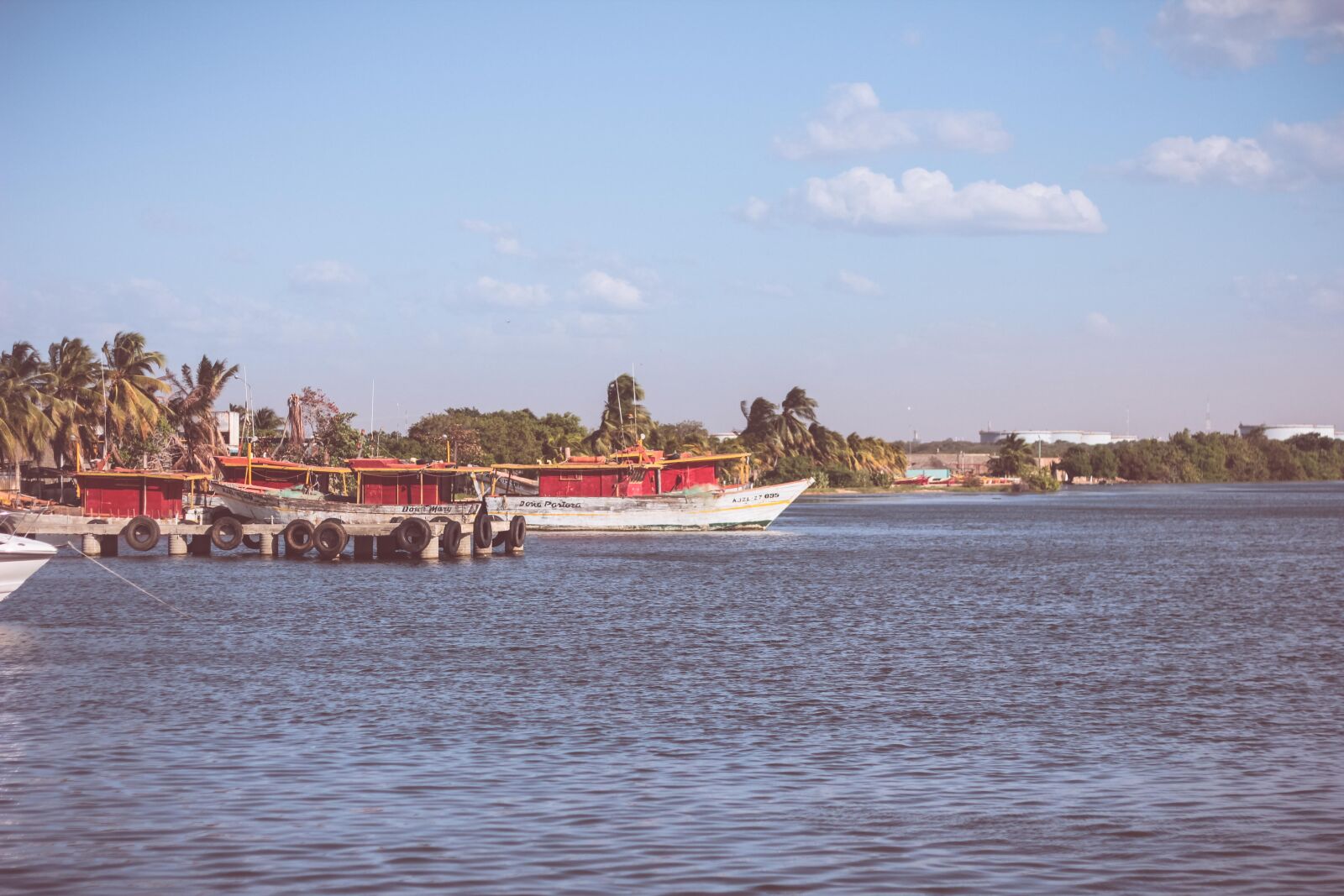 Canon EOS 60D + Canon EF 50mm F1.8 II sample photo. Blue, boat, clouds, deep photography