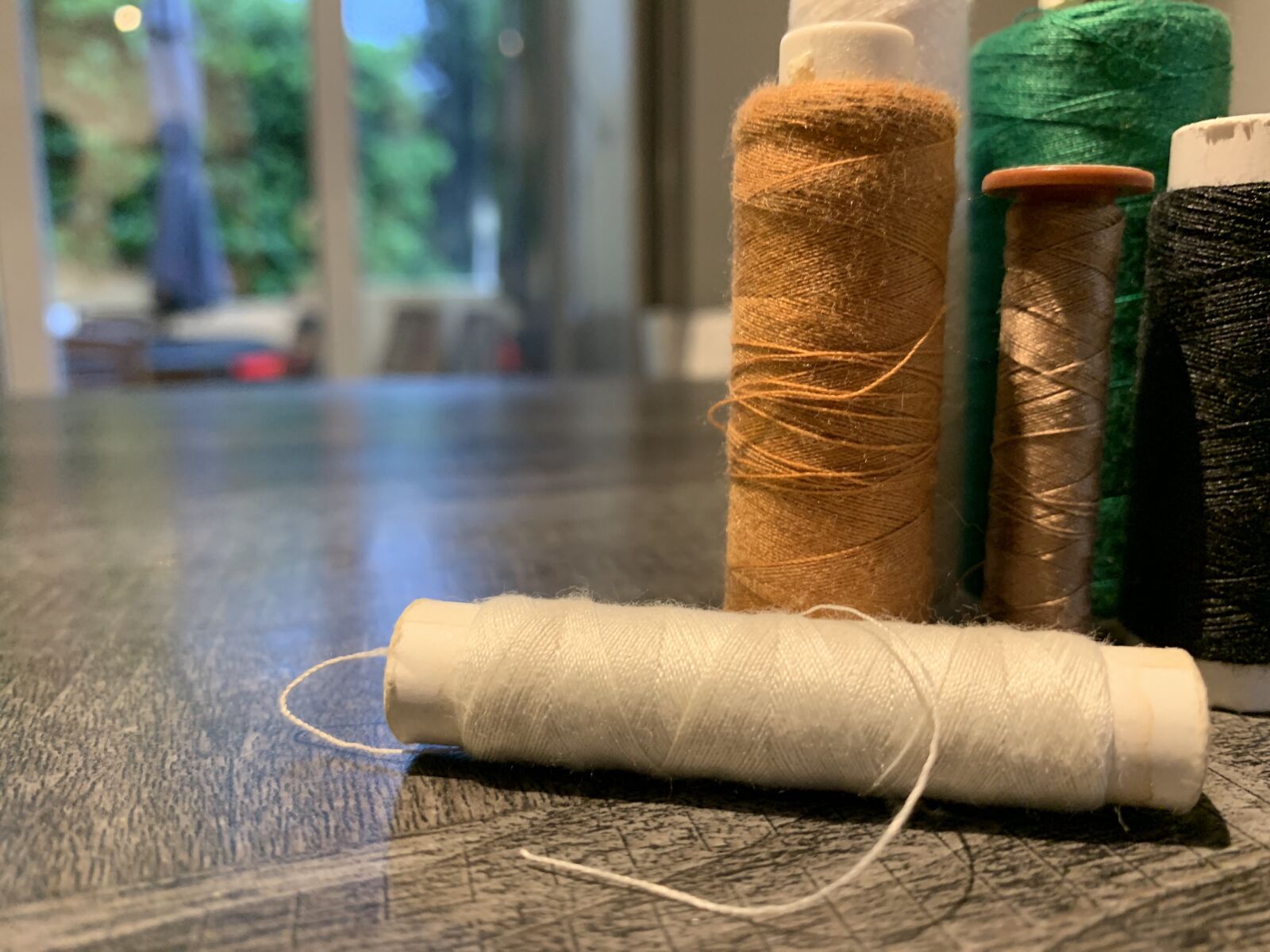Apple iPhone XR sample photo. White wire, thread gold photography
