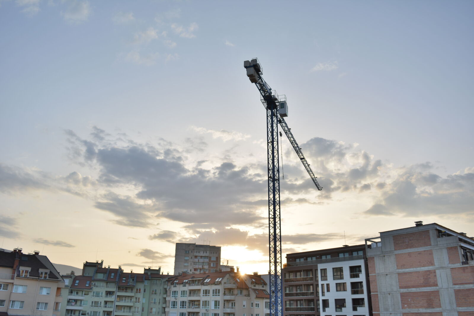 Nikon D5200 sample photo. Buildings, clouds, construction, crane photography