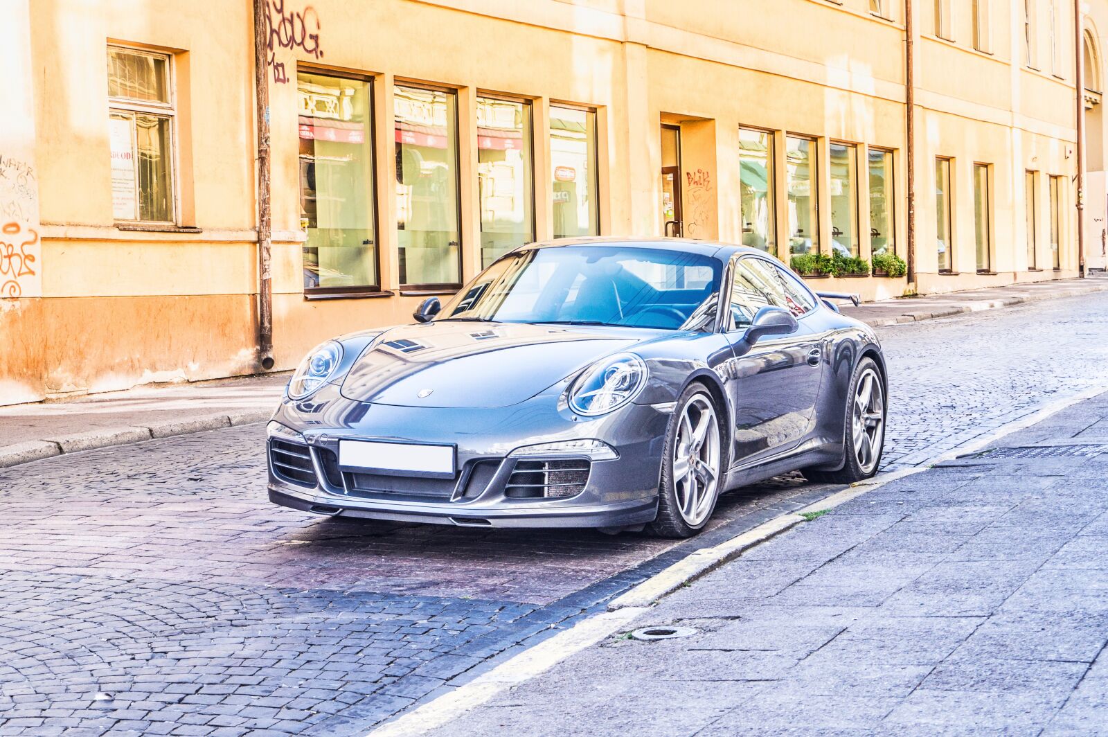 Sony Alpha a5000 (ILCE 5000) sample photo. Blue, sports car, city photography