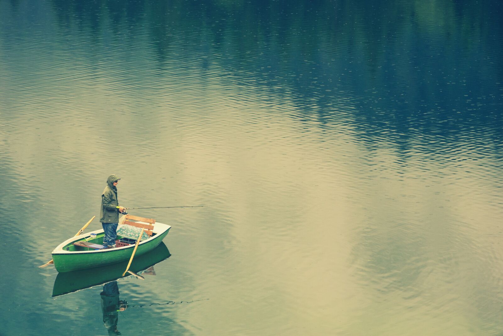 Sony a7 + Sony DT 50mm F1.8 SAM sample photo. Fisherman, boat, rain photography