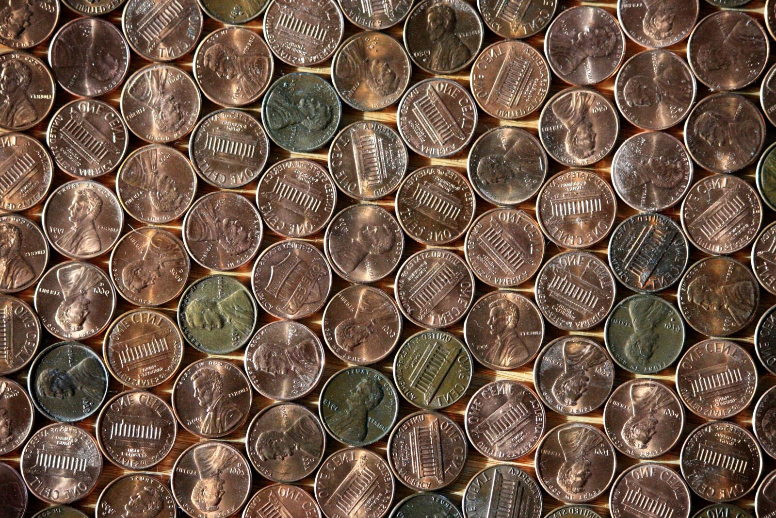 Canon EOS 1000D (EOS Digital Rebel XS / EOS Kiss F) + f/4-5.6 IS II sample photo. Pennies, money, metal coins photography