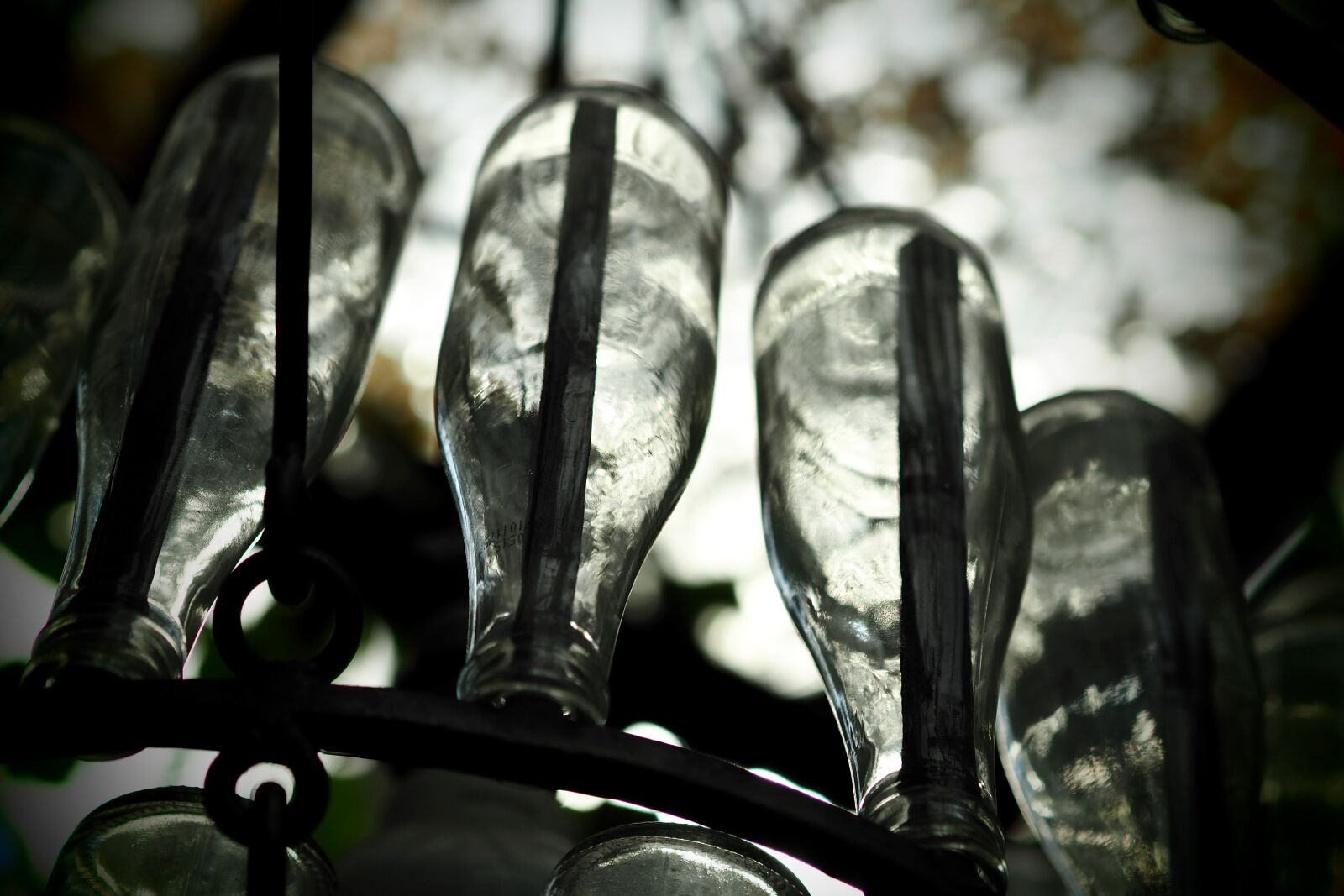 Olympus OM-D E-M5 II sample photo. Bottle of water, chandelier photography