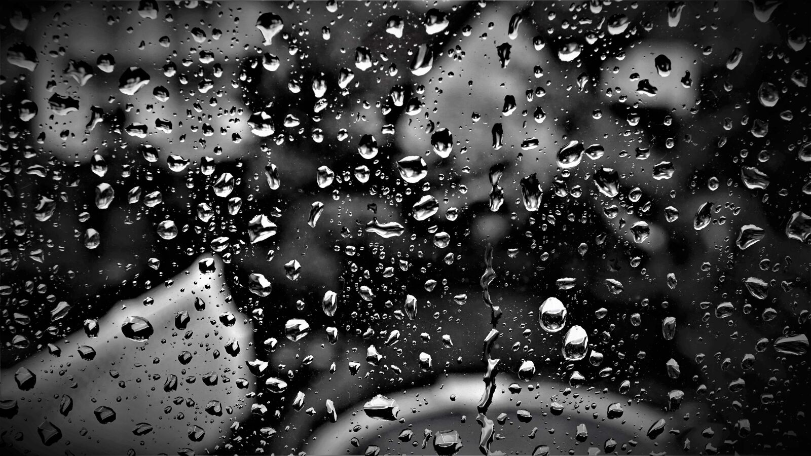 Sony a6000 + Sony E 30mm F3.5 Macro sample photo. Rain, window pane, black photography