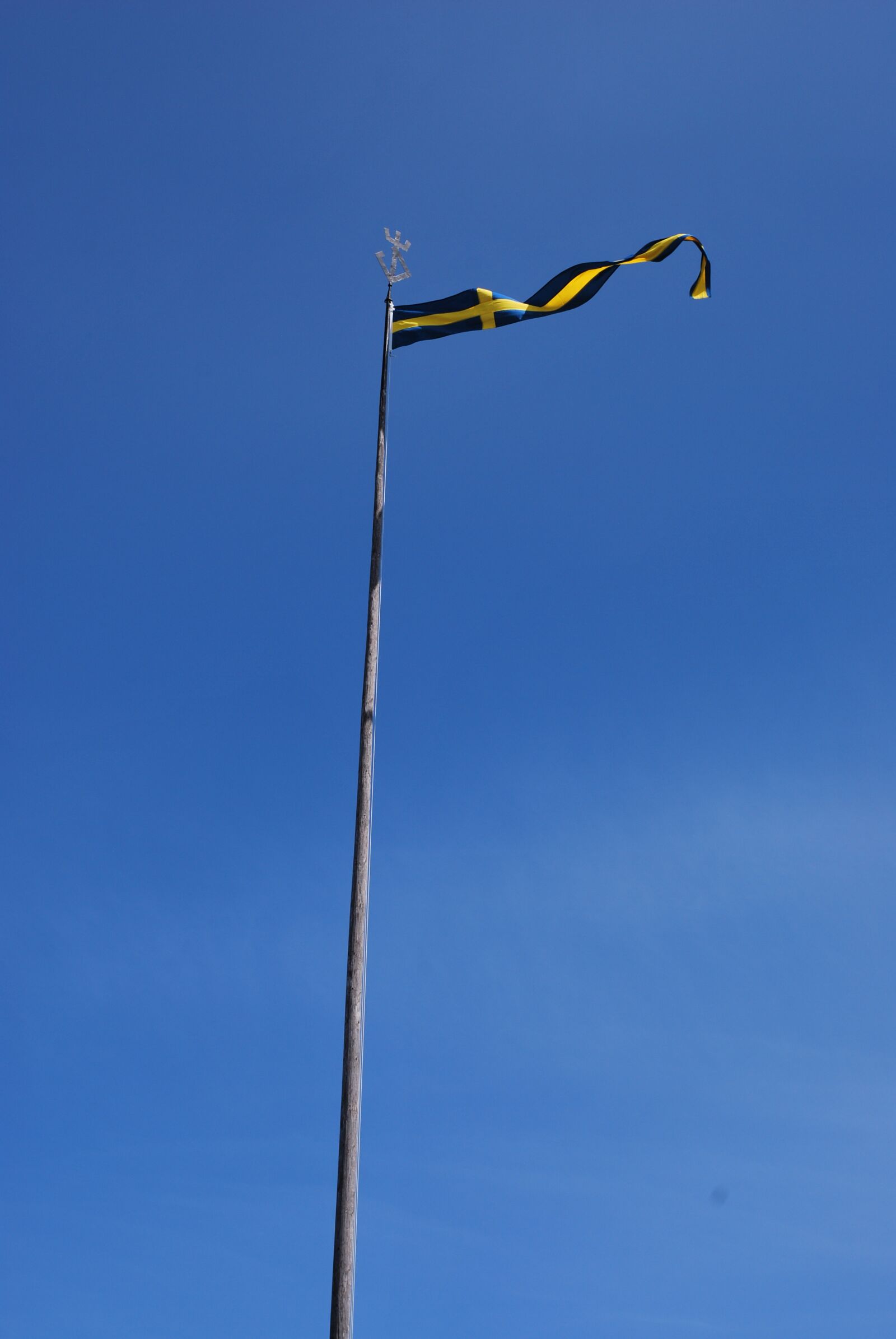 Nikon D60 sample photo. Sweden, flag, blue sky photography