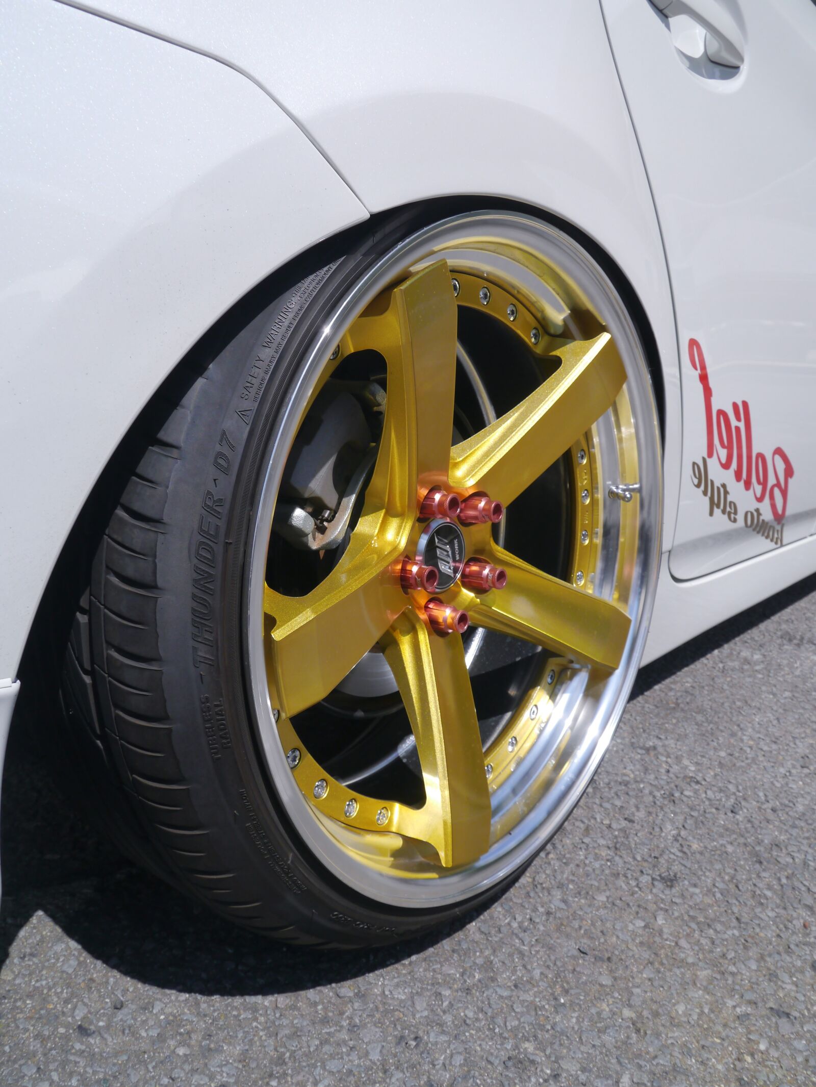 Panasonic Lumix DMC-GX1 sample photo. Toyota vehicles, hybrid, wheel photography