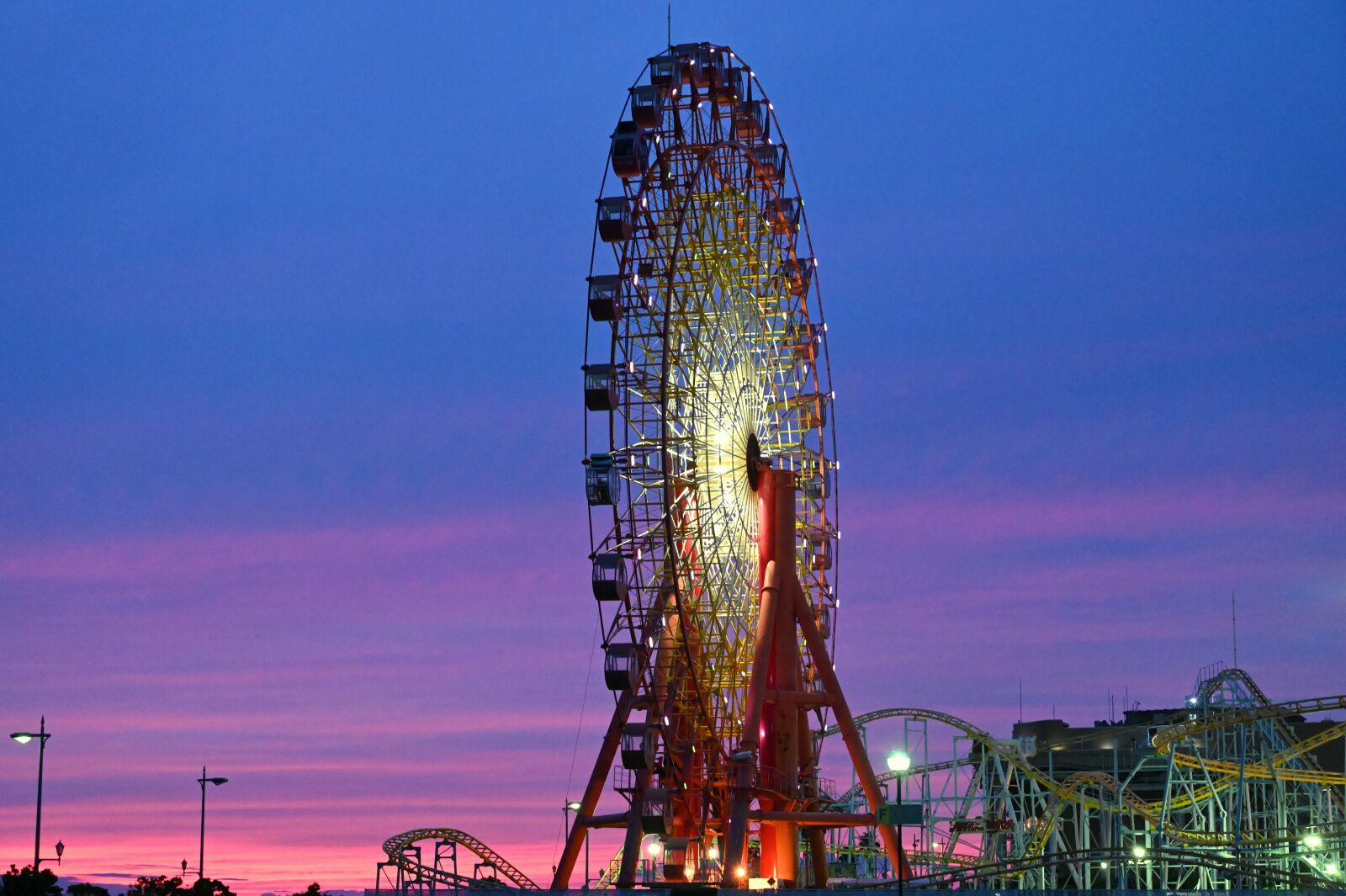 Nikon Nikkor Z 24-70mm F2.8 S sample photo. Sunset, amusement park, ferris photography
