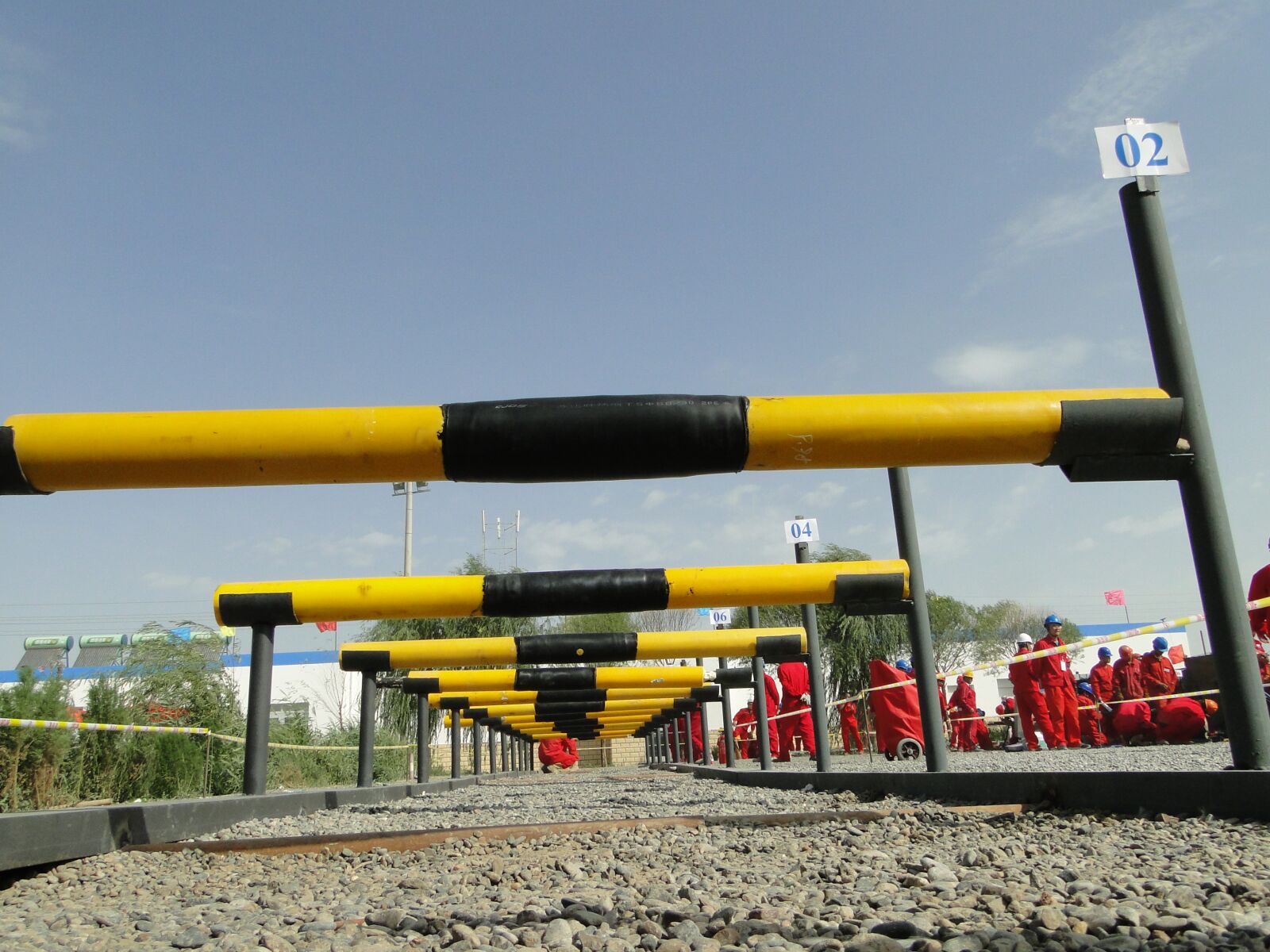 Sony Cyber-shot DSC-HX1 sample photo. Oil workers, railing, pipeline photography