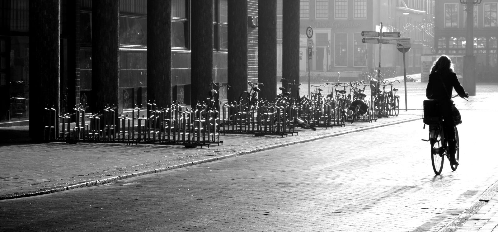 Sony Cyber-shot DSC-RX100 sample photo. Cyclists, road, black and photography