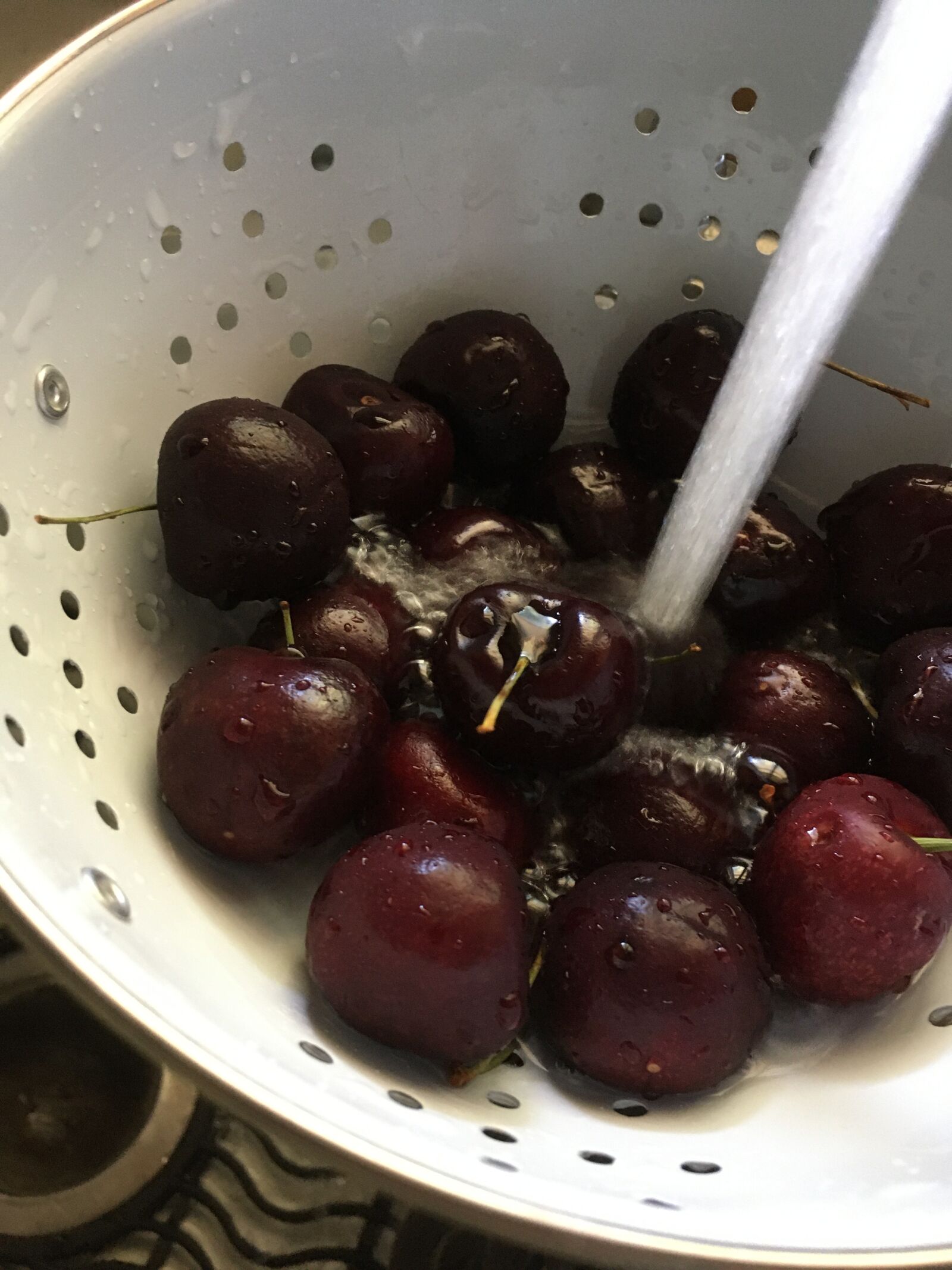 Apple iPhone SE (1st generation) sample photo. Cherries, colander, rinse photography