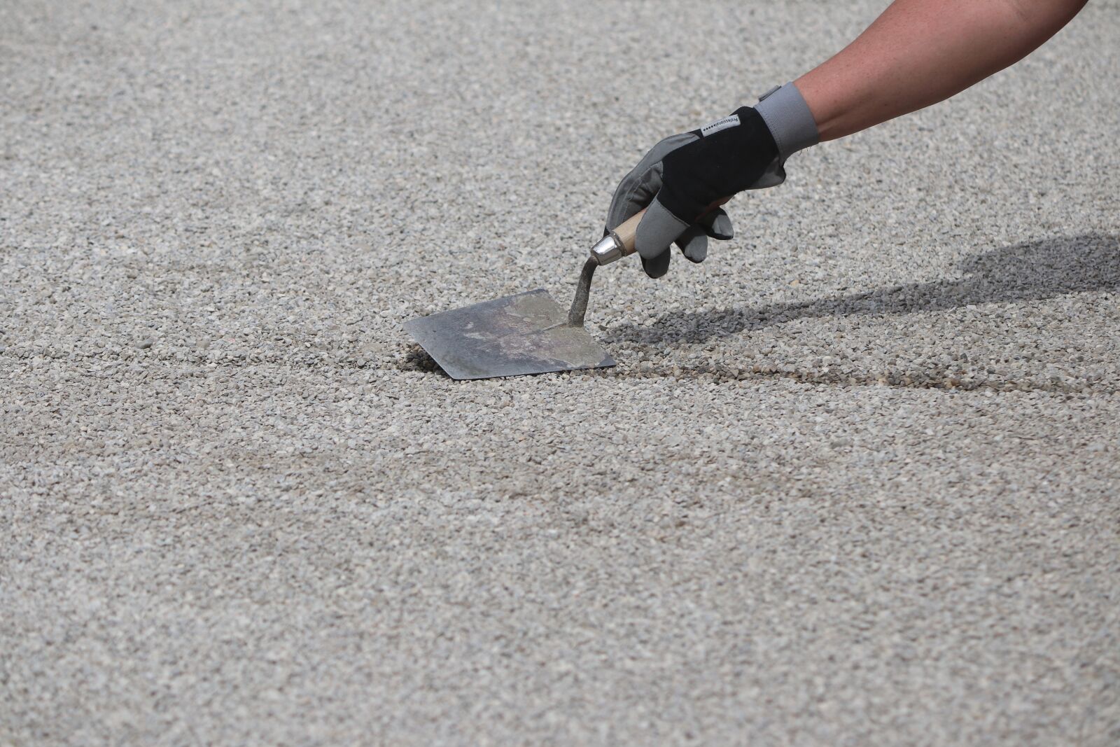 Canon EOS 80D sample photo. Pebble, hand, gravel bed photography