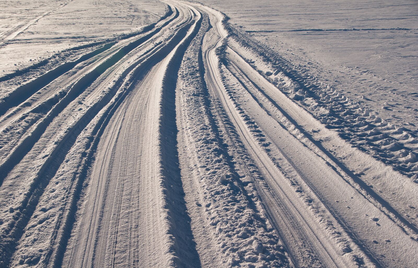 Pentax K10D sample photo. Snow, traces, road photography