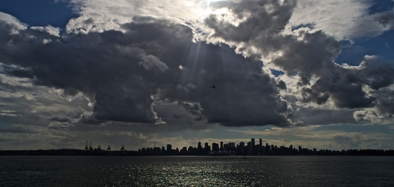 Sony a6300 + Sony E 16mm F2.8 sample photo. North vancouver, clouds, airplane photography