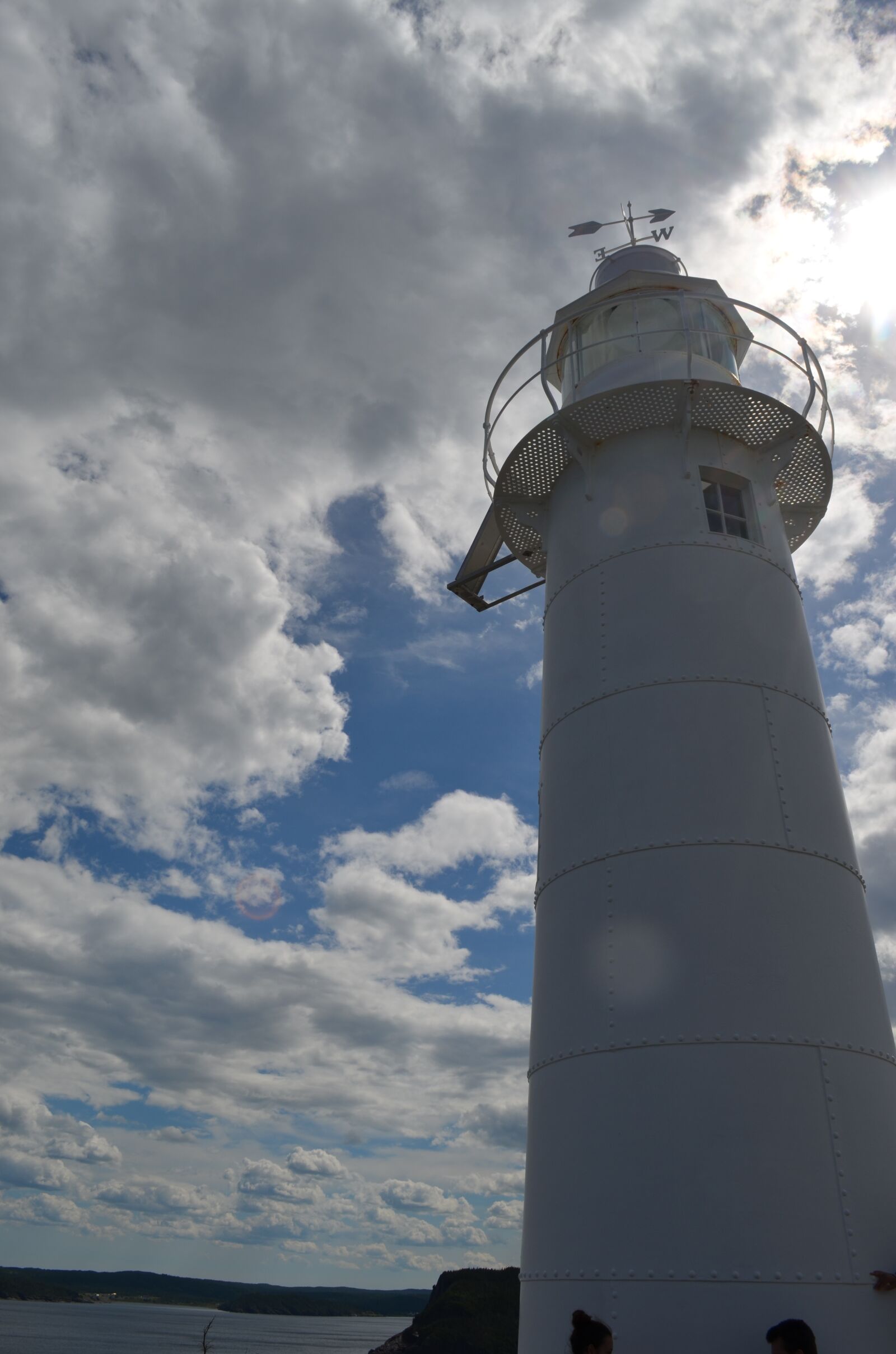 Nikon D5100 sample photo. Lighthouse, white clouds, newfoundland photography
