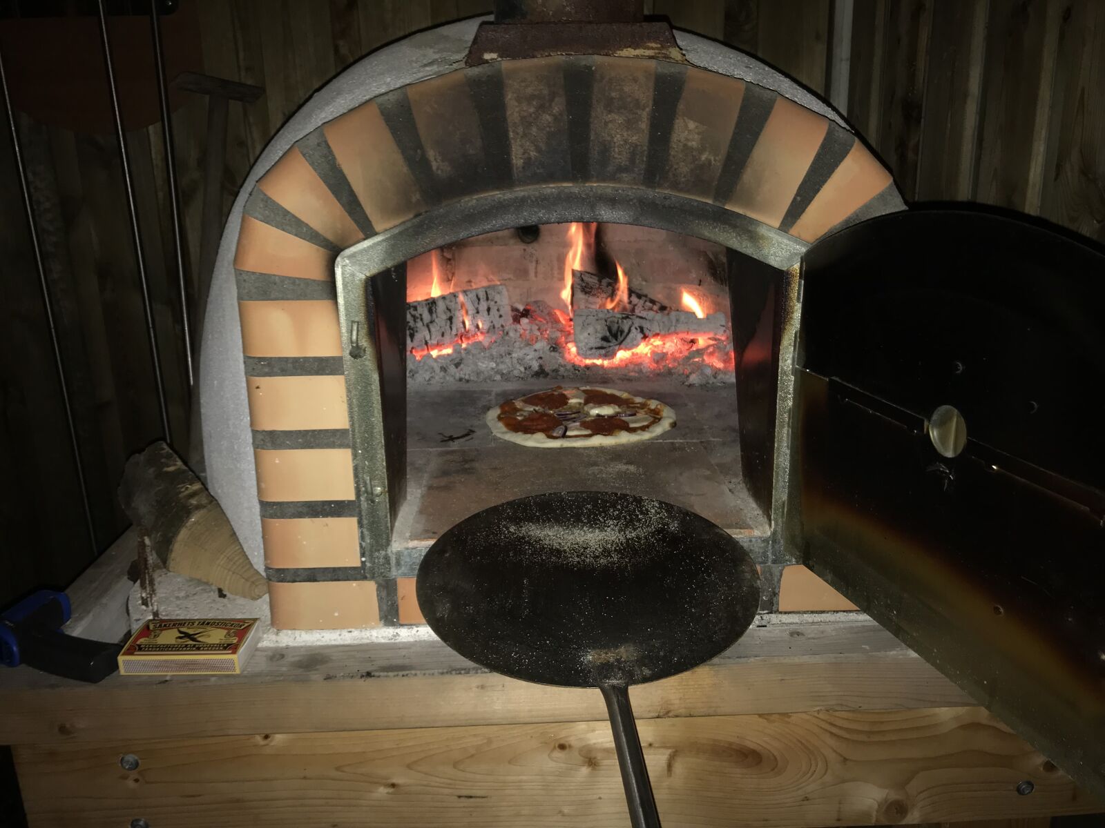 iPhone 7 back camera 3.99mm f/1.8 sample photo. Wood-fired oven, pizza, wood photography