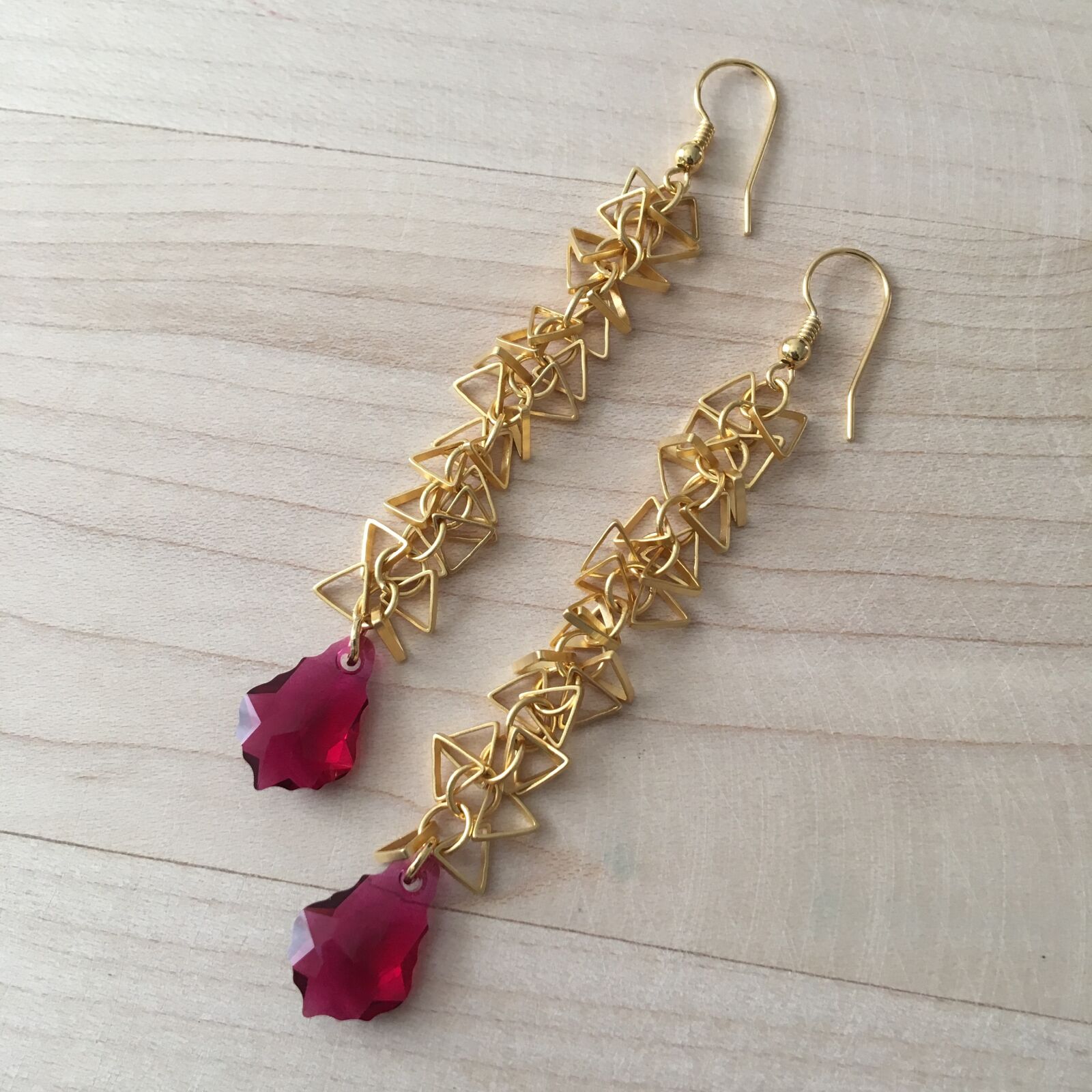 iPhone 6s back camera 4.15mm f/2.2 sample photo. Eaerrings, long earrings, ruby photography