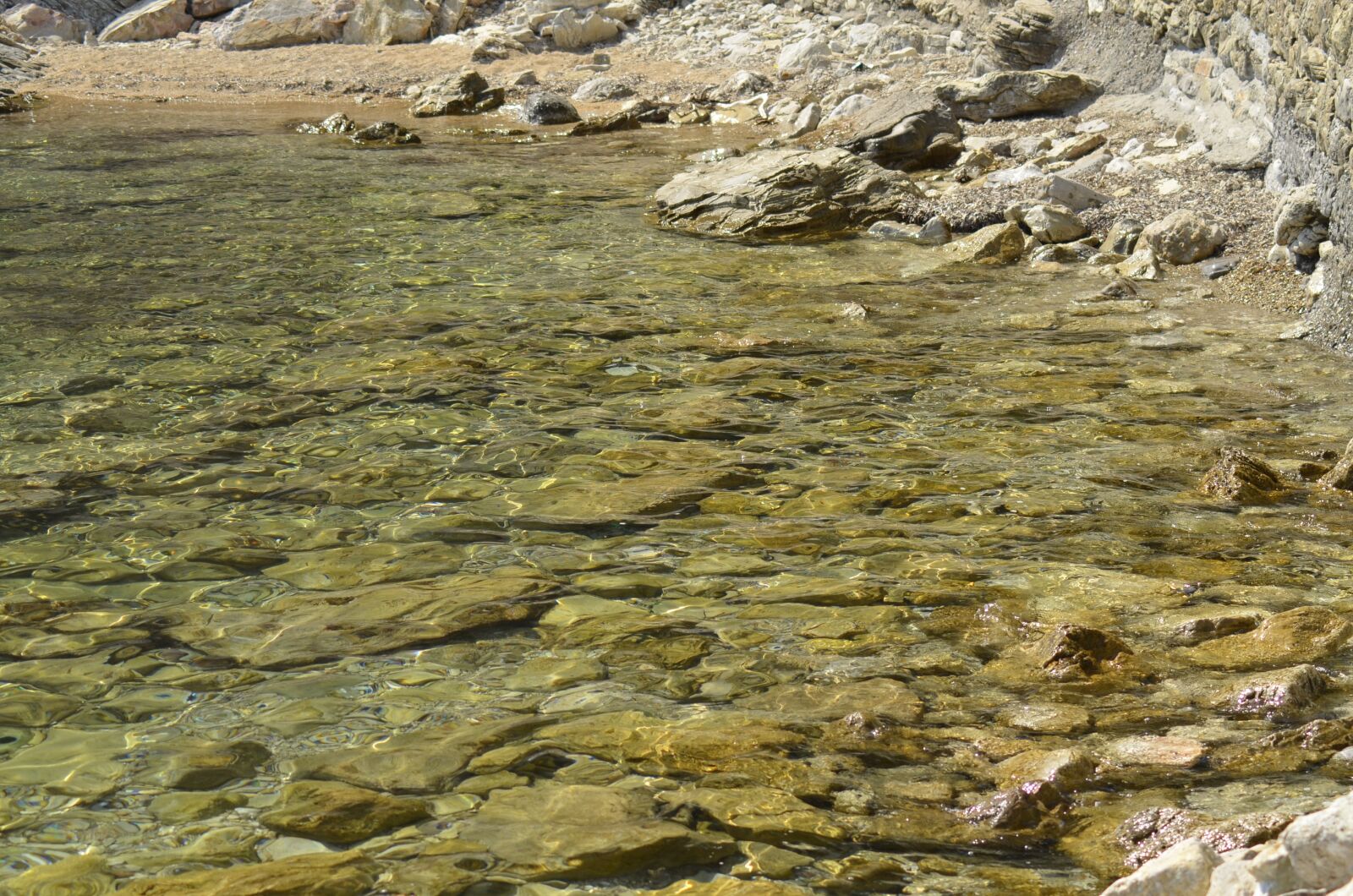 Nikon D5100 sample photo. Clear water, rocks, sea photography