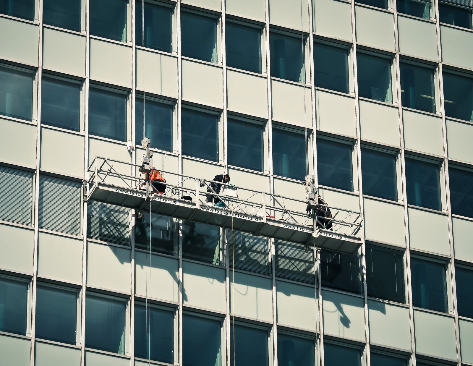 Olympus OM-D E-M10 sample photo. Facade, window, window cleaner photography