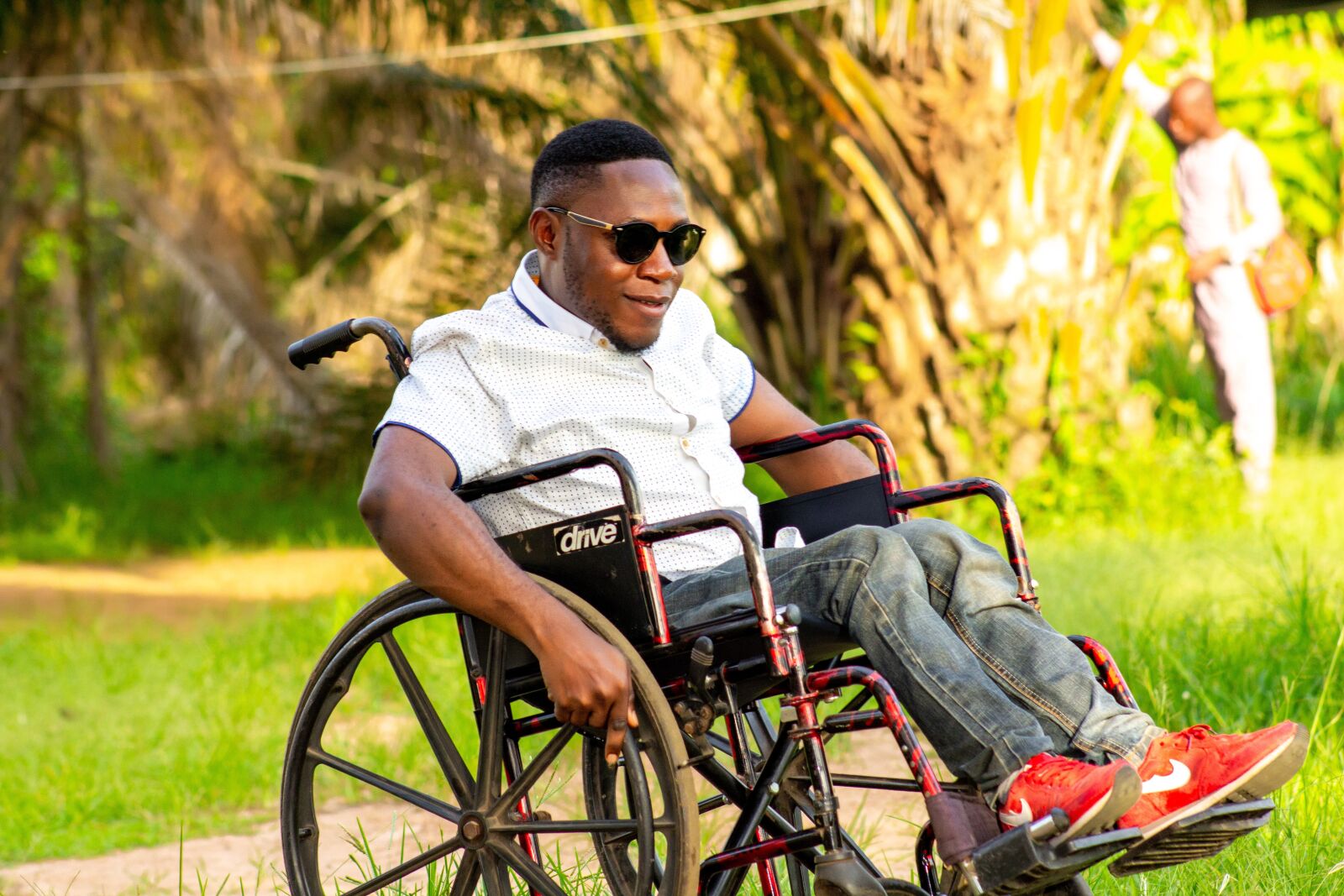 Canon EF75-300mm f/4-5.6 sample photo. Man on a wheelchair photography