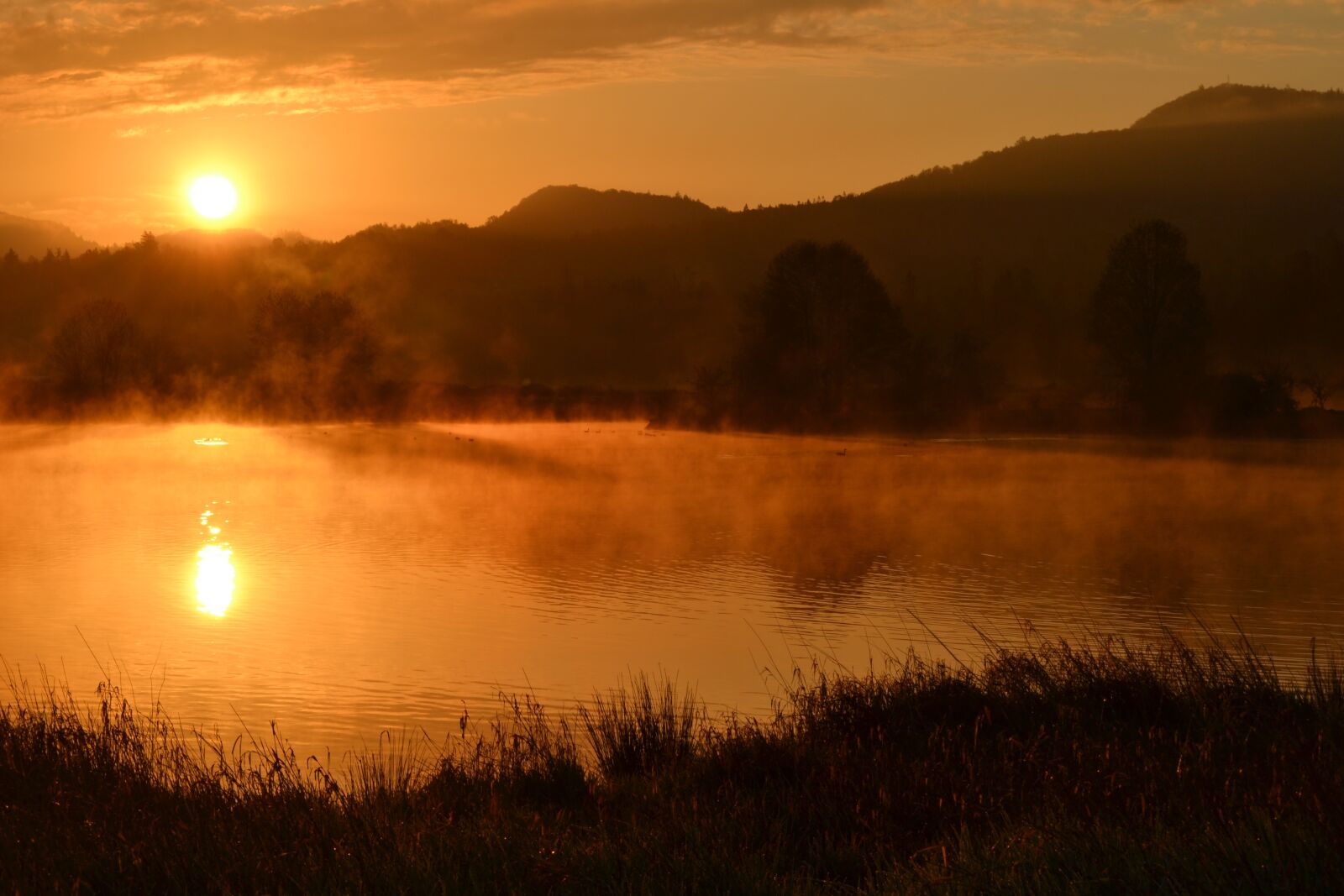 Nikon D3100 sample photo. Sunrise, pond, hills photography